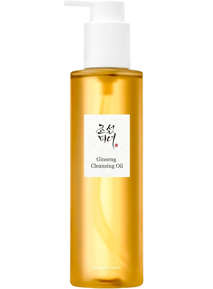 A gold-colored bottle of Ginseng Cleansing Oil with a white pump dispenser and a white label with black Korean characters, English text, and a red seal.