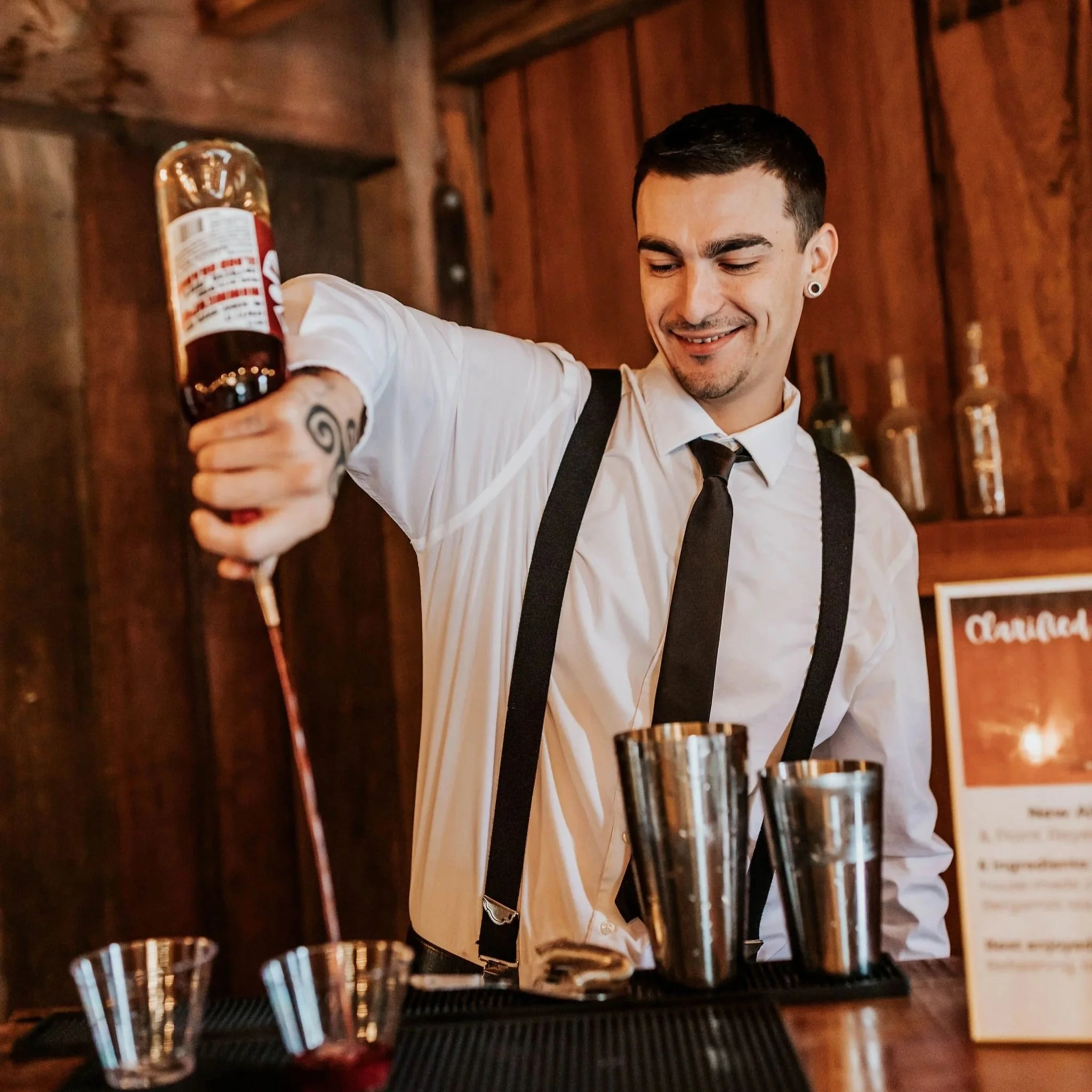 Rudy Trevino, Crafted. & Company lead mixologist / bartender and event staff pouring drinks