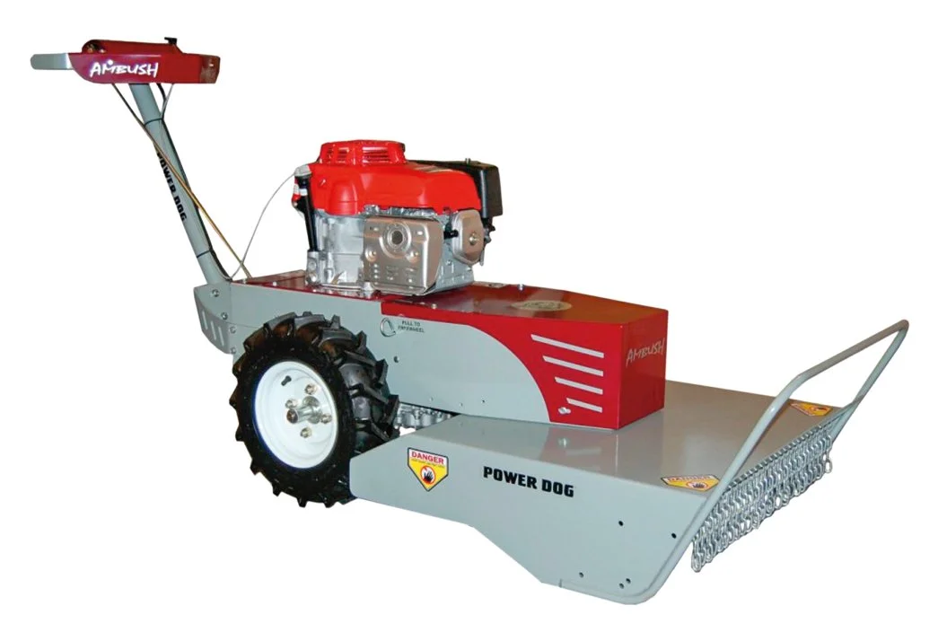 A machine called 'Power Dog' with a gas-powered engine, large rear wheel, and a flat platform with a rake at the front, used for lawn or snow clearing.