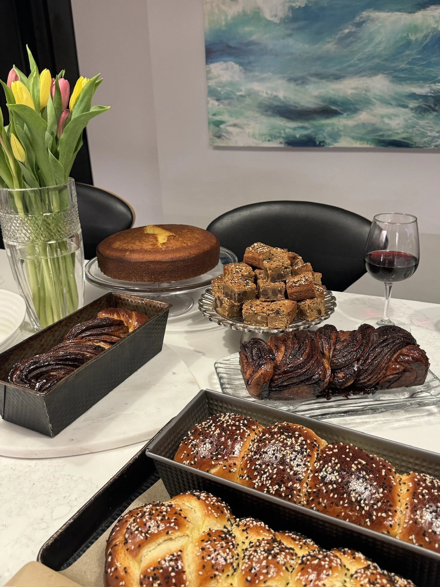 Black and White Sesame challahs, babkas, an olive oil cake and Tahini Blondies just after baking.