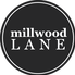 Black circular logo with white text reading 'millwood LANE'.