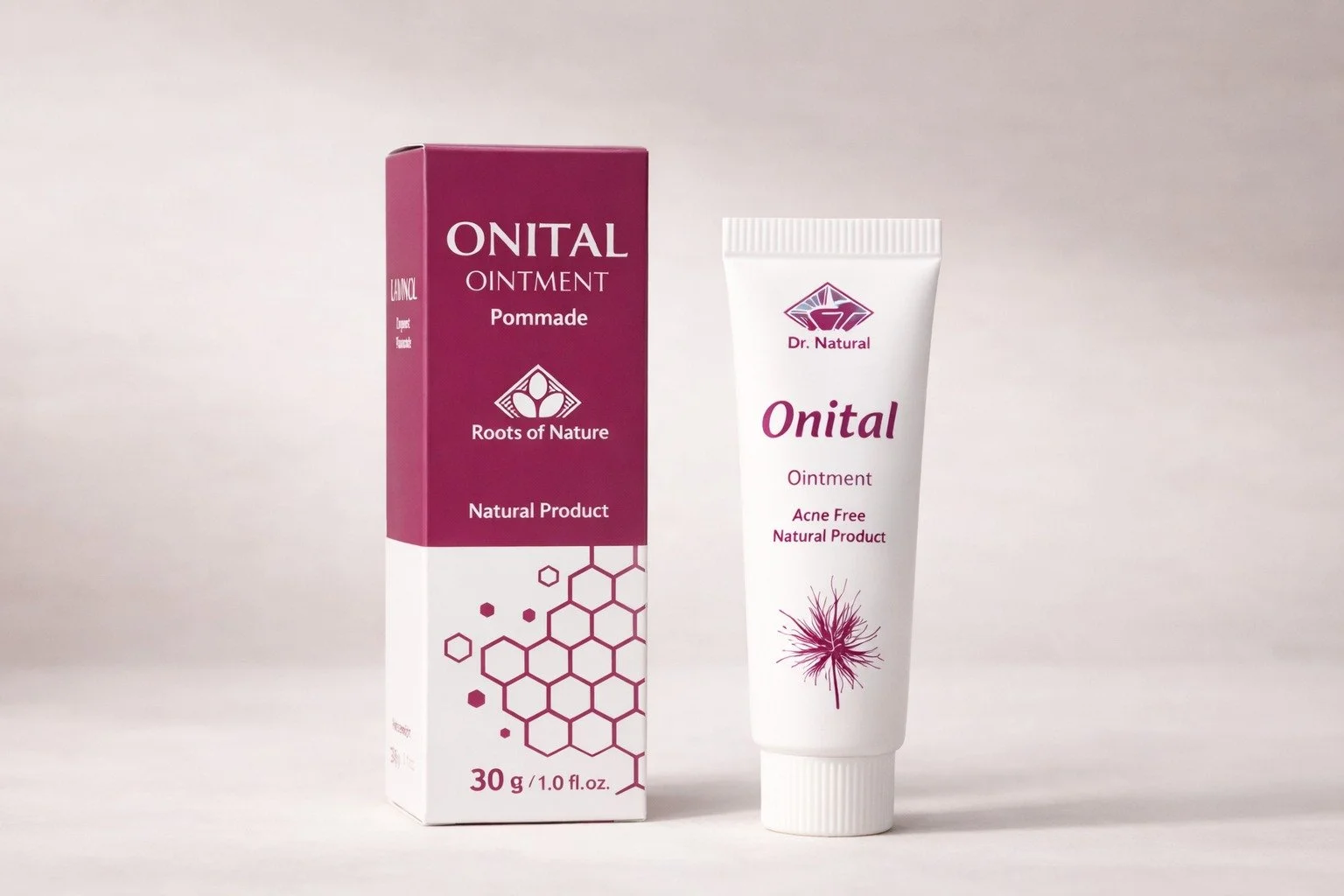 A tube of Onital ointment standing beside its purple and white packaging box on a neutral background.