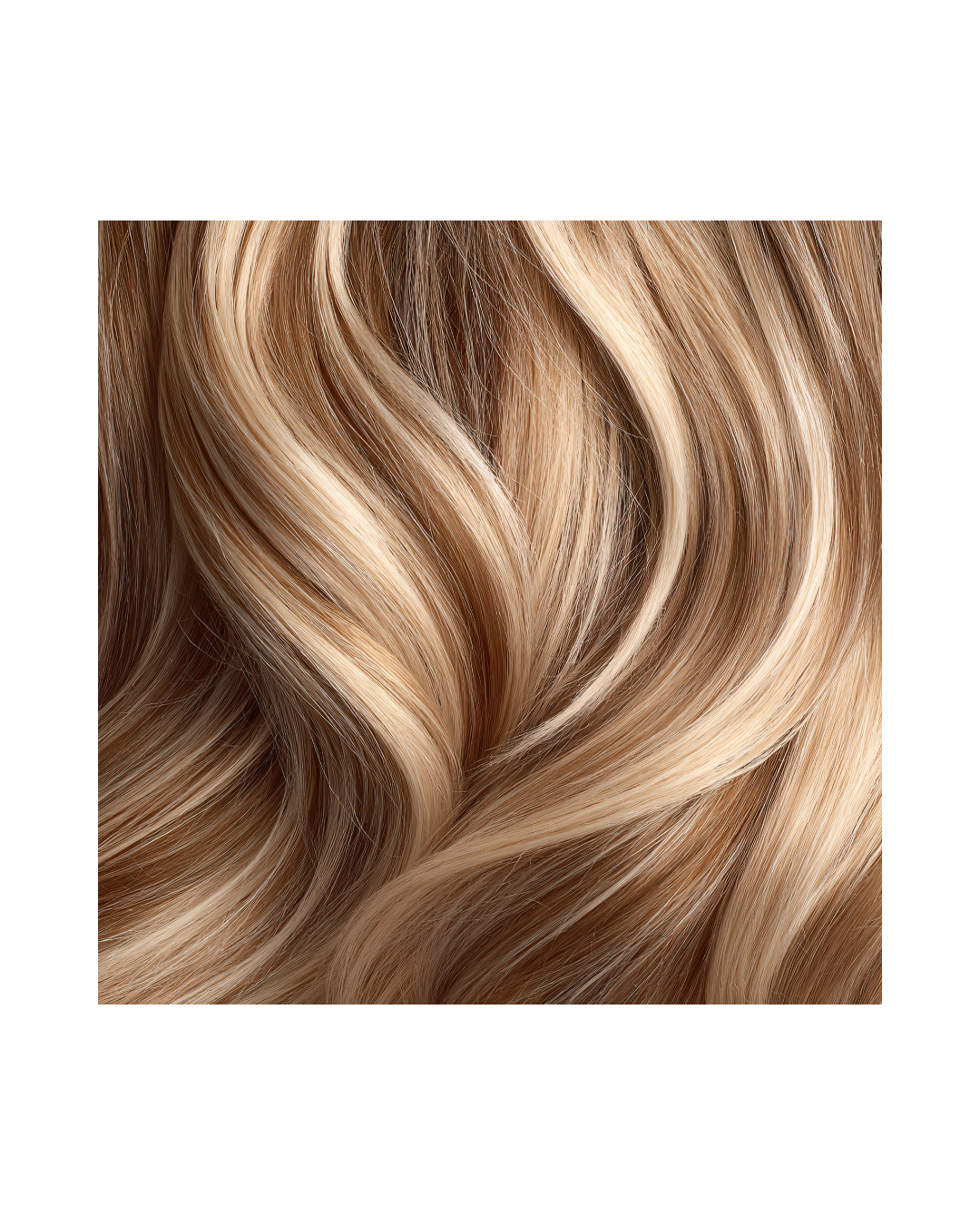 Close-up of wavy blonde hair with highlights.