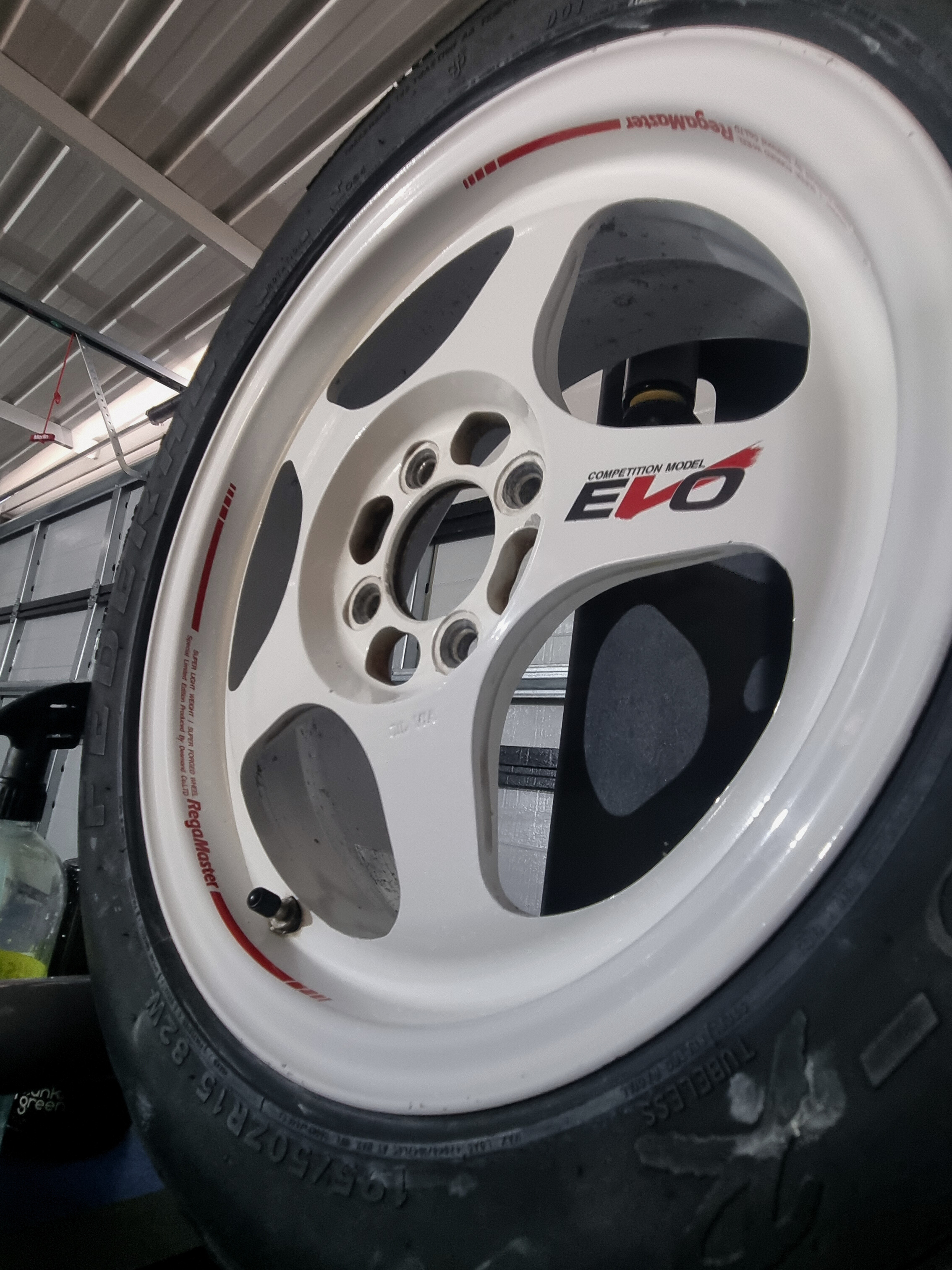 Specialized wheel correction and ceramic coating on white Desmond Regamaster Evo wheels in Perth. Professional restoration and protection of rare forged racing wheels.