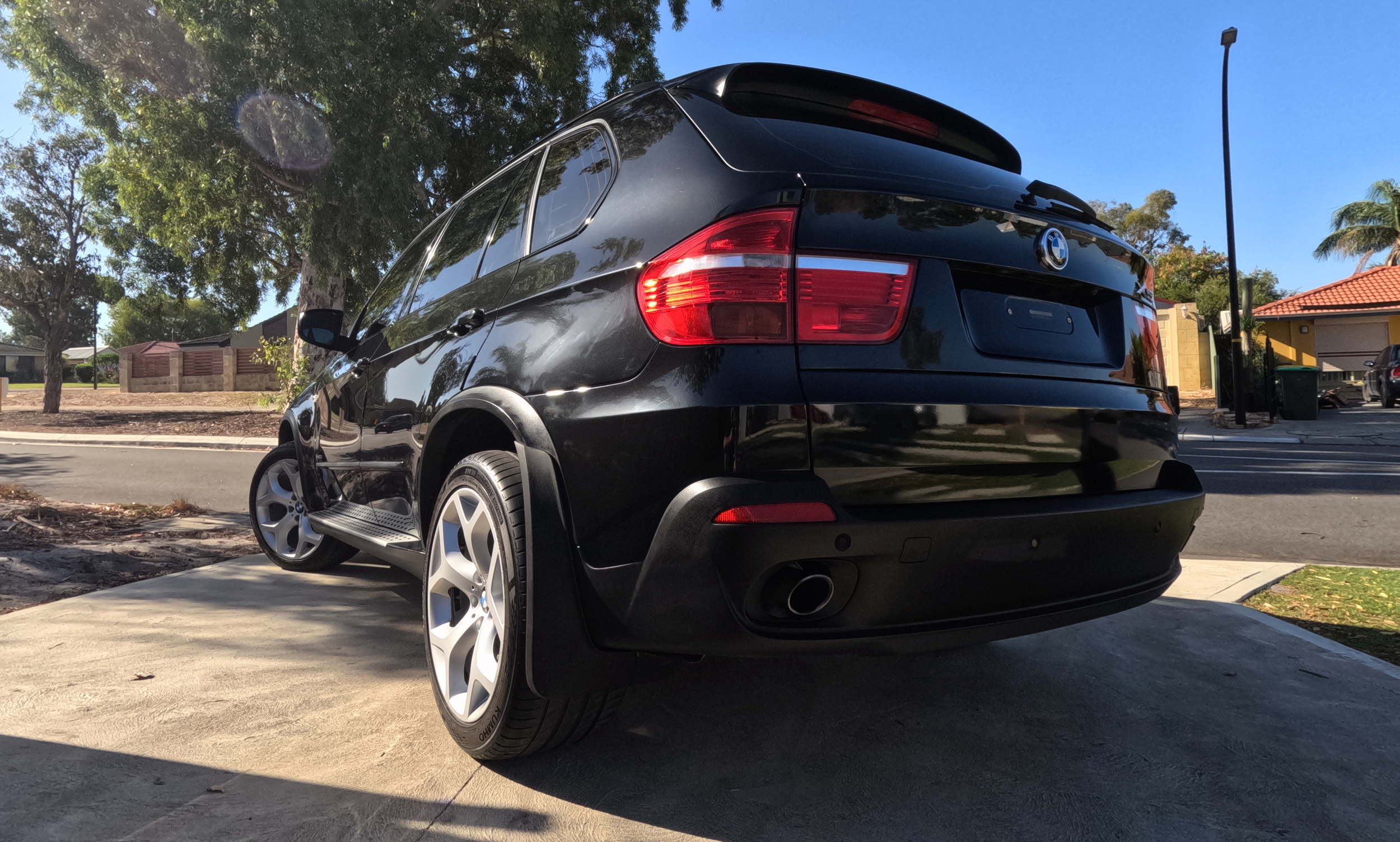 Ceramic paint protection and full paint correction on a black BMW X5 Sport in Perth. Professional buff, cut & polish to restore deep black gloss and remove swirl marks on a luxury SUV.