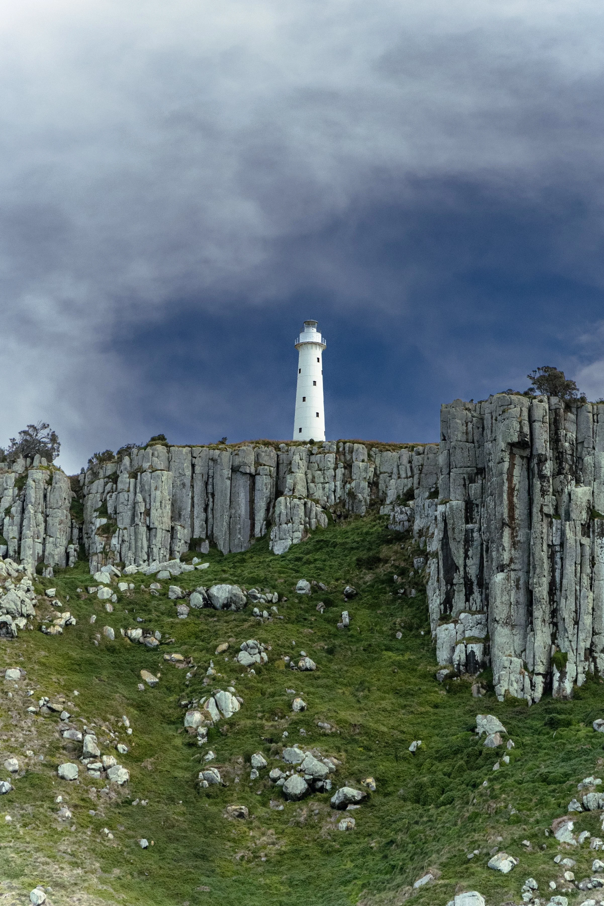 Tasman Island Lighthouse.
Standing on Tasmania’s rugged coast, the Tasman Island Lighthouse has guided sailors since 1905. From wild seas to ghostly tales, it stands as a symbol of courage, isolation, and the mysteries of the southern ocean.