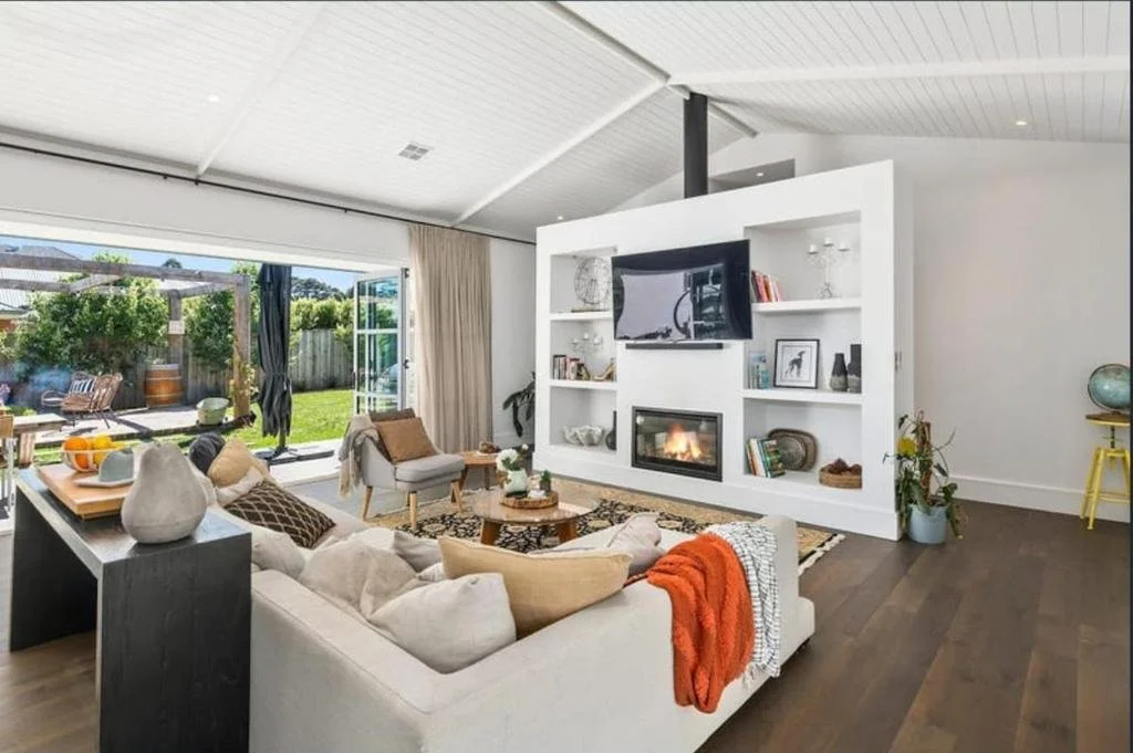 Spacious luxury living room at Fairfax Pavilion Bowral with fireplace