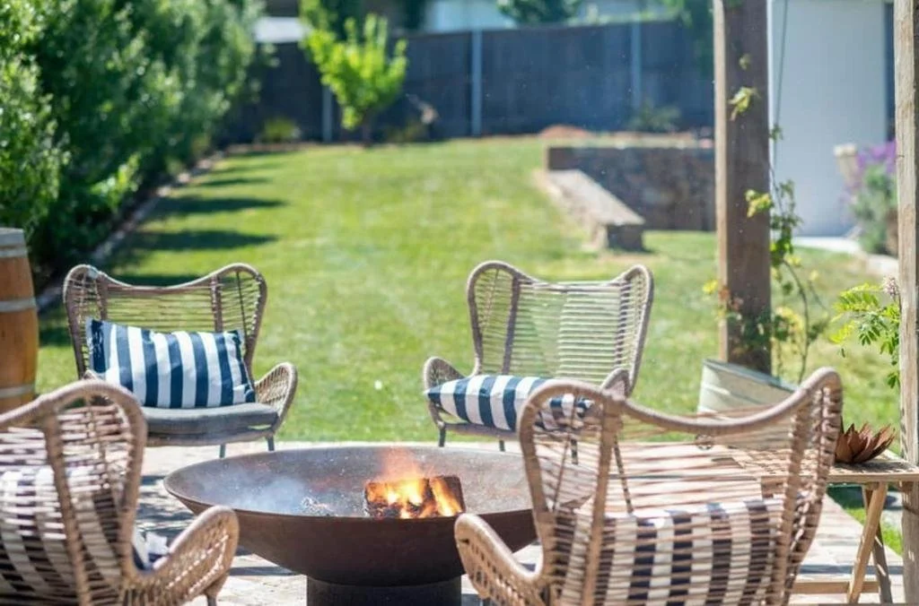 Outdoor entertaining area with BBQ and firepit at Fairfax Pavilion Bowral