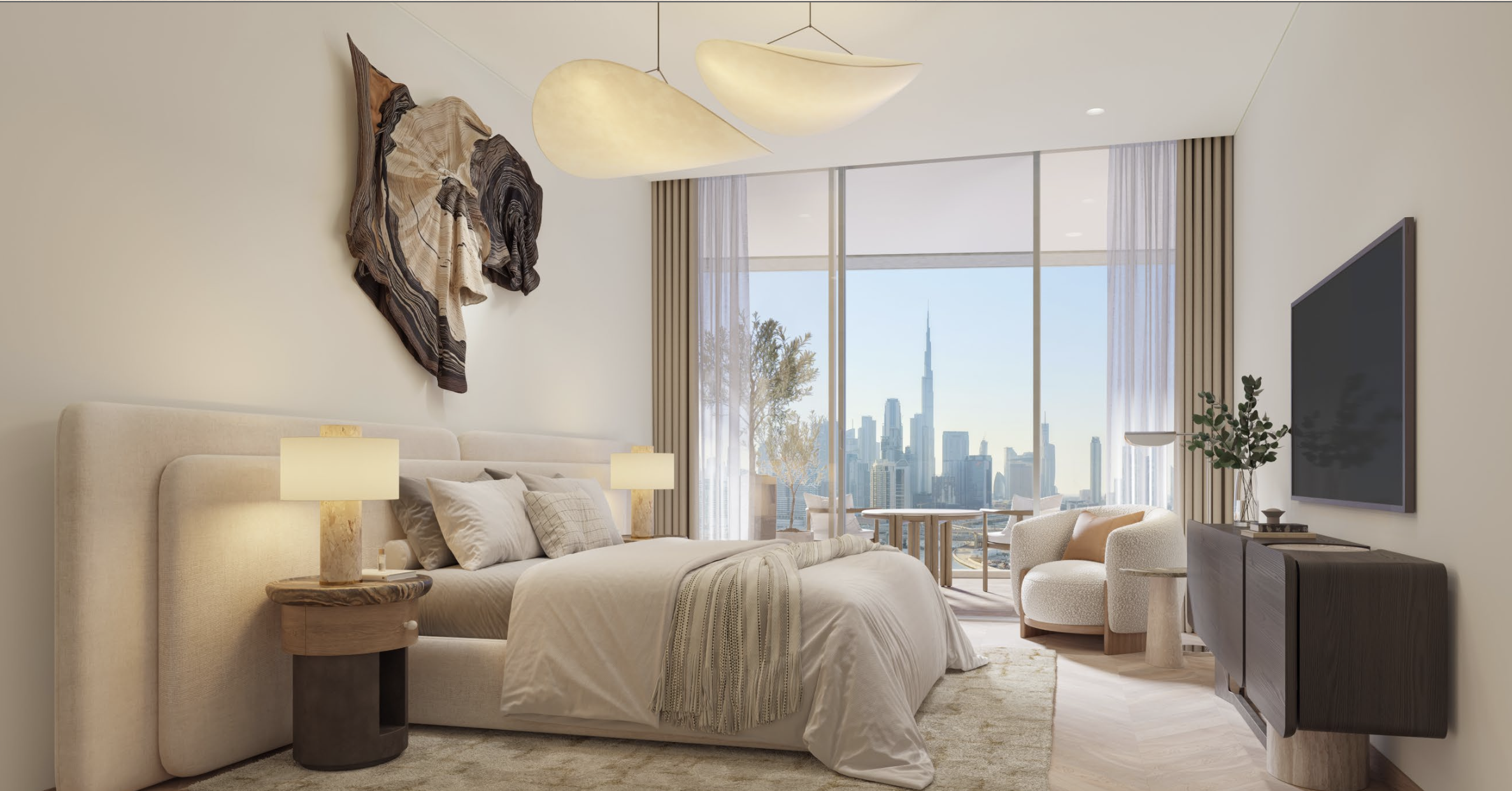 Modern bedroom with a large bed, bedside lamps, abstract wall art, and a view of a city skyline through large glass windows, with a sitting area outside.