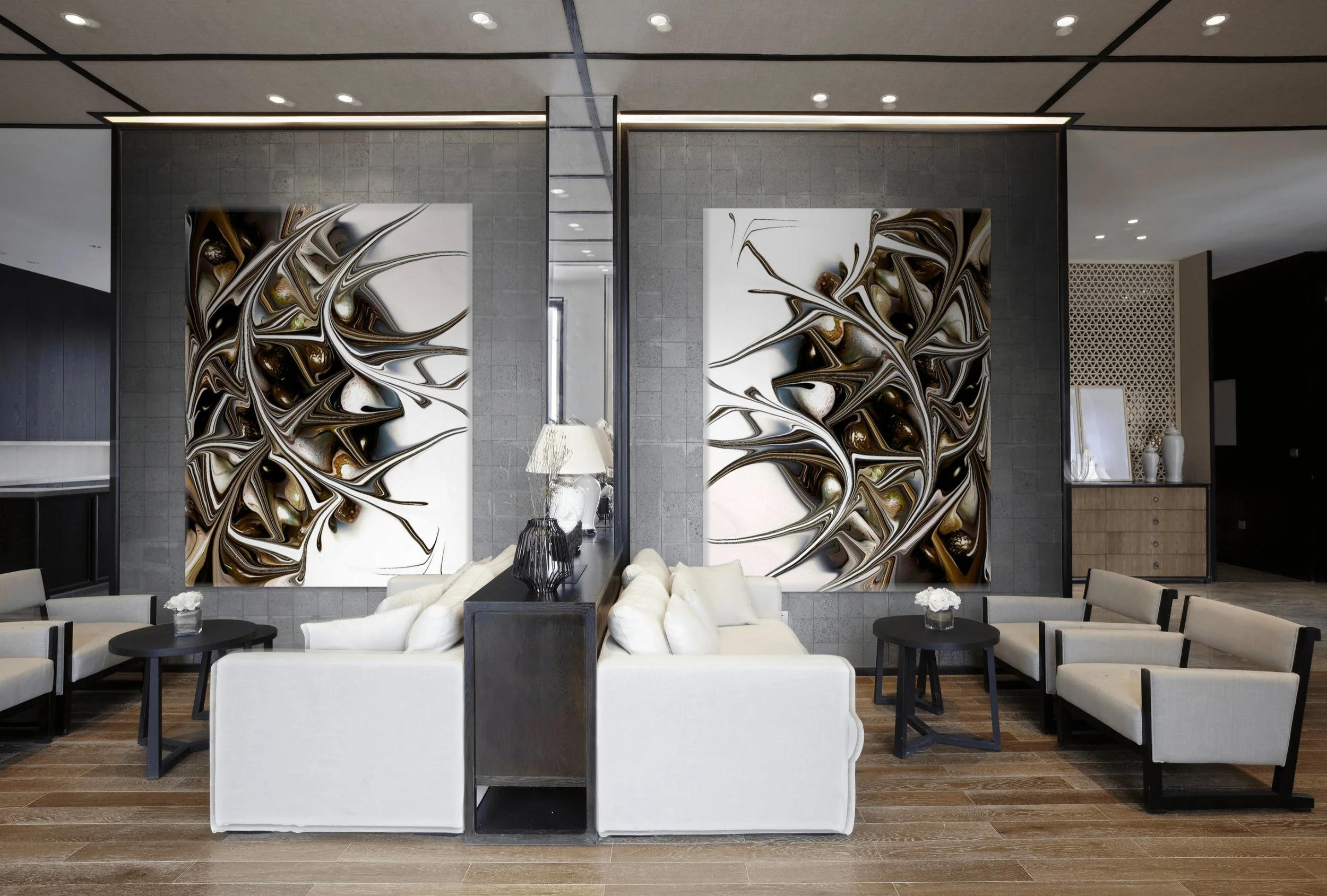 Modern hotel lobby with abstract artwork, white sofas, black coffee tables, and decorative vases.