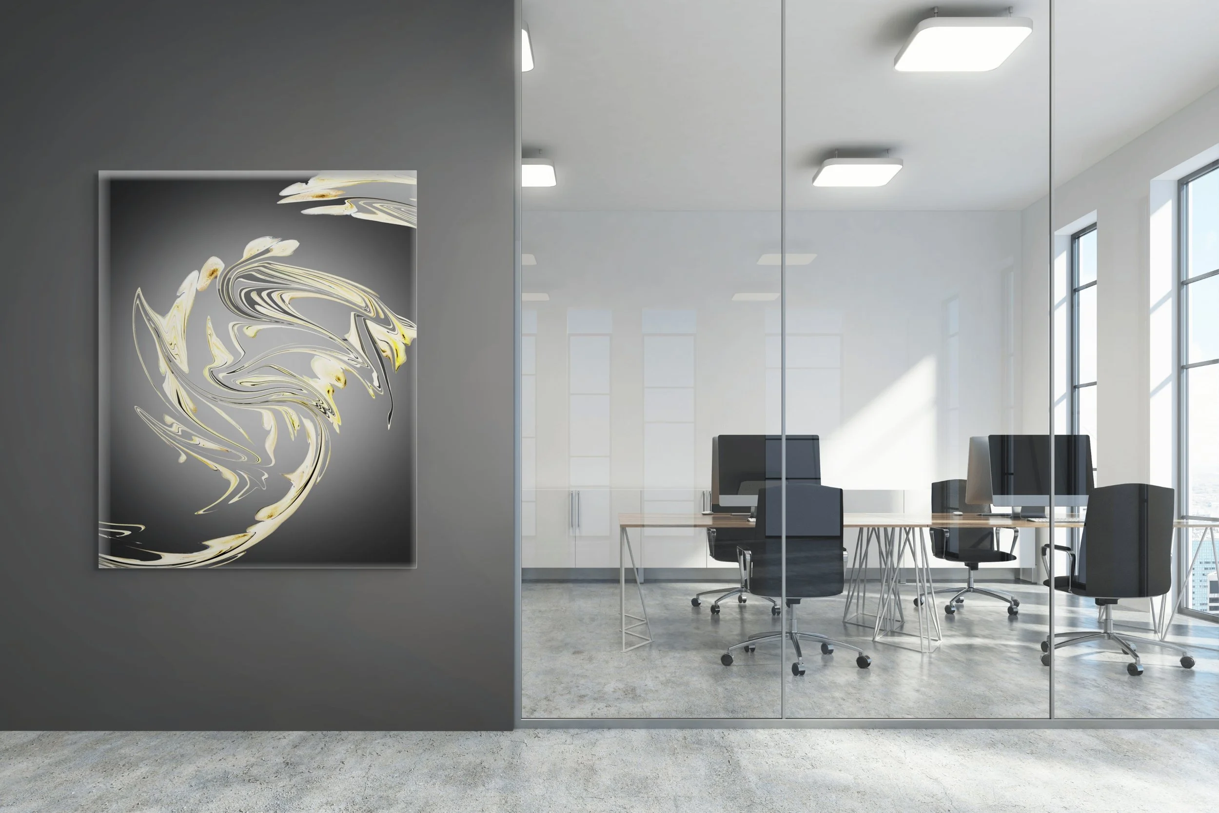 Modern office interior with glass walls, black office chairs, and a table, featuring abstract art on a gray wall.