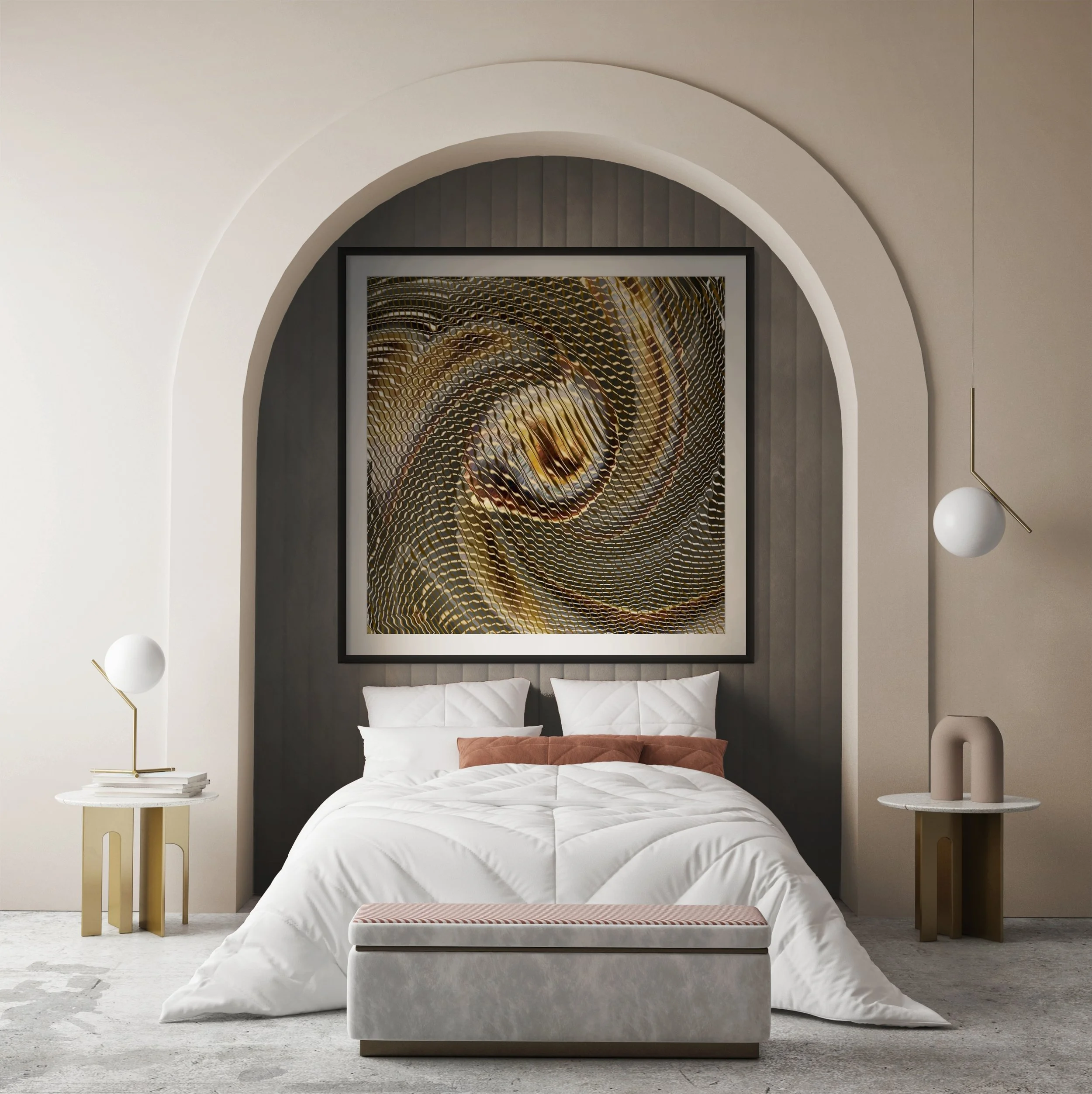 A modern bedroom with a white bed, beige and rust cushions, a marble bench at the foot of the bed, and two beige side tables with white lamps. Abstract artwork hangs above the bed on dark paneled wall, with curved archways and minimalist decor.