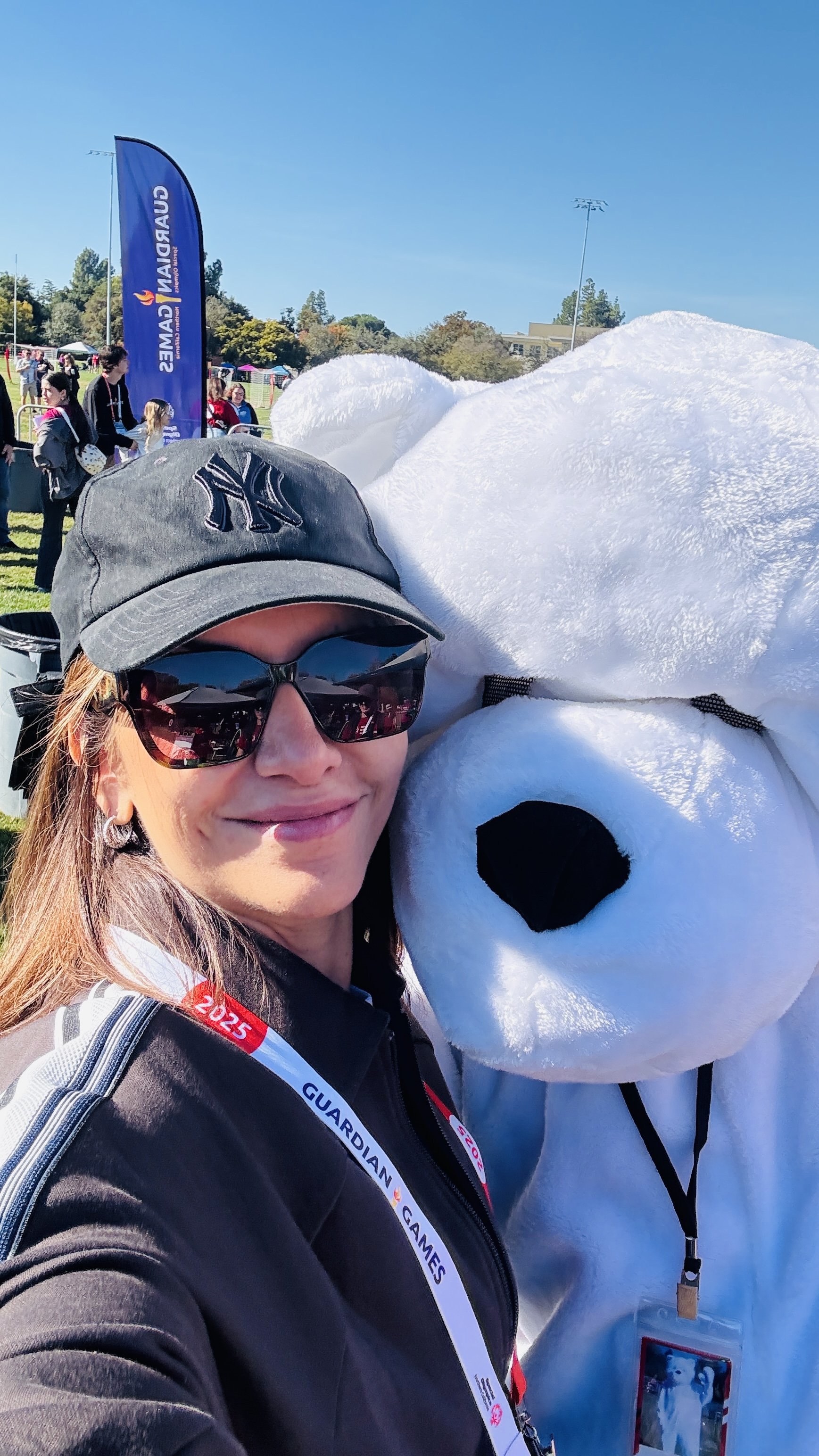 Tina hugging bear Mascot SOlympicsIMG_4460.jpeg