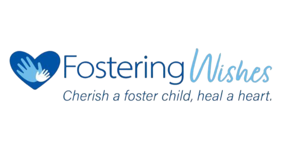Fostering Wishes logo with a blue heart and hands, motto 'Cherish a foster child, heal a heart'.