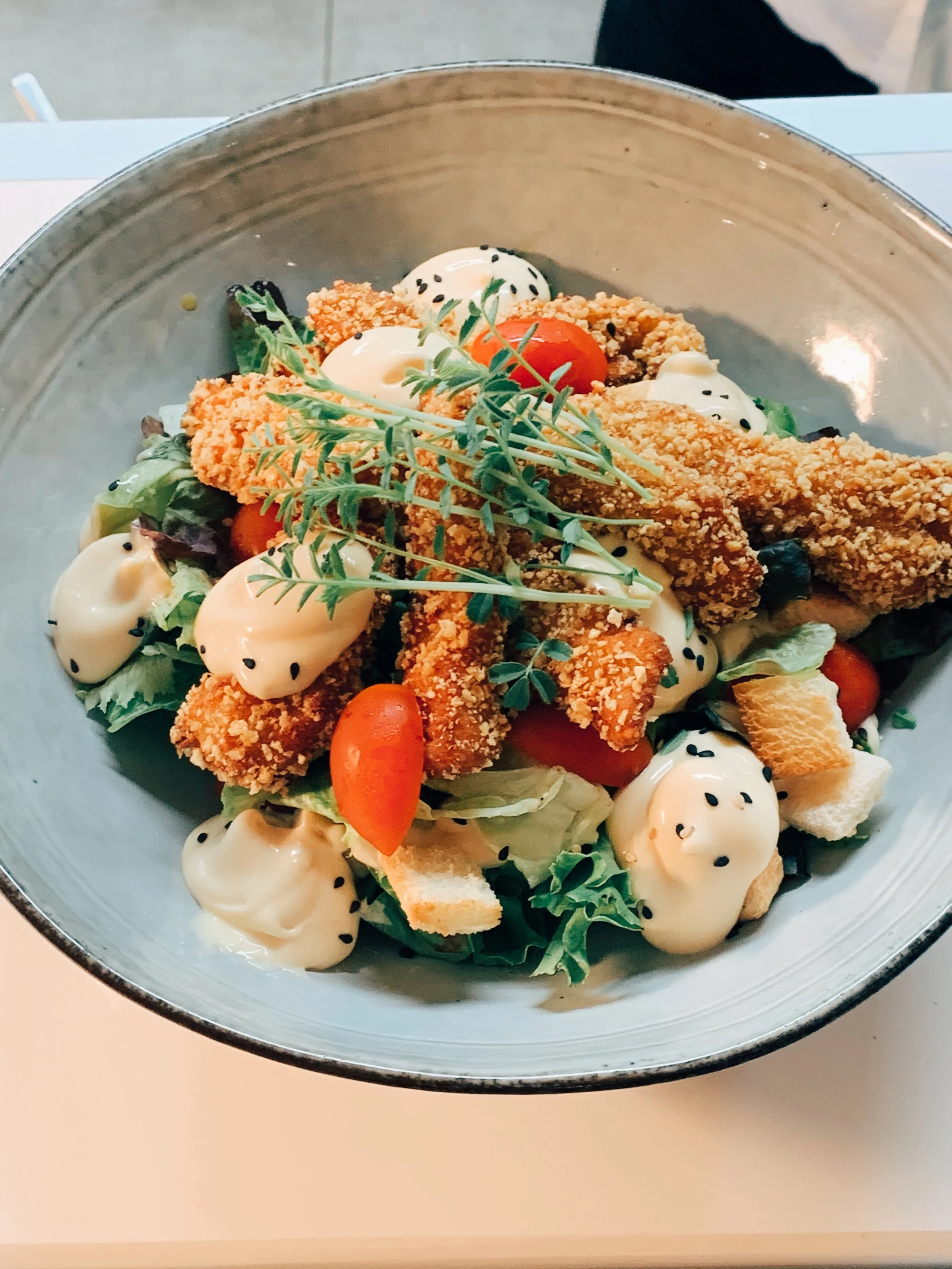 Fresh chicken salad served at Mokelino restaurant by the sea in Los Cristianos.