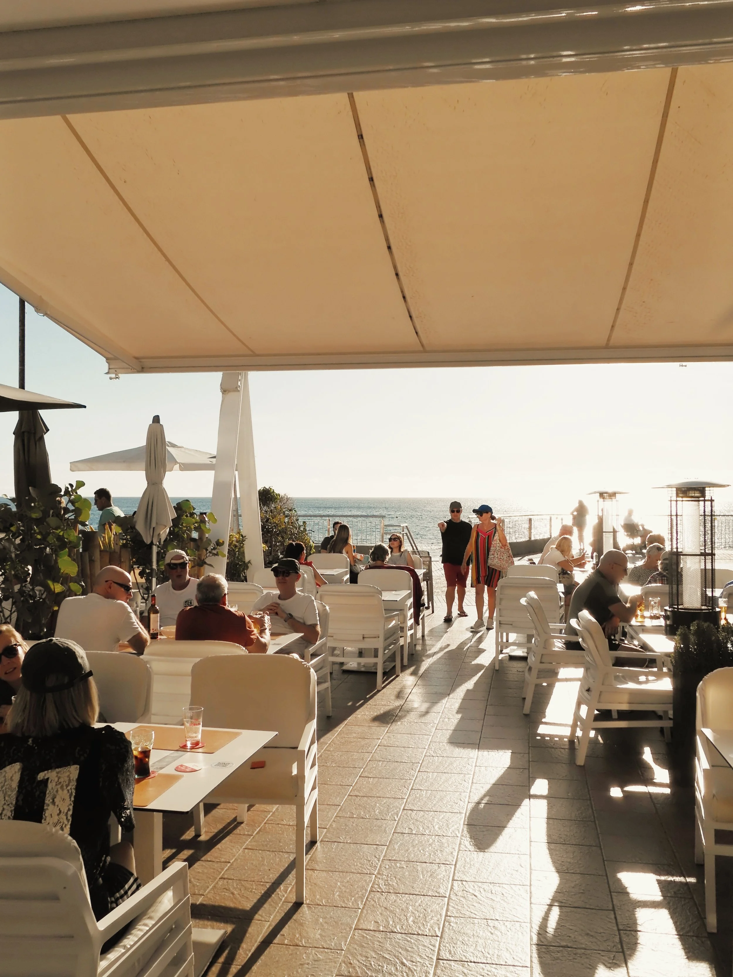 Outdoor terrace at Mokelino with sea views in Los Cristianos, Tenerife.