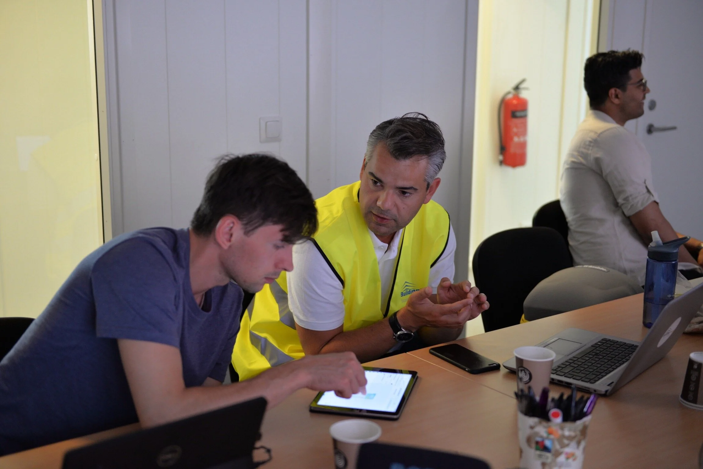 IMAGE: Marcus in conversation with a customer at the construction site of Randselva Bridge.