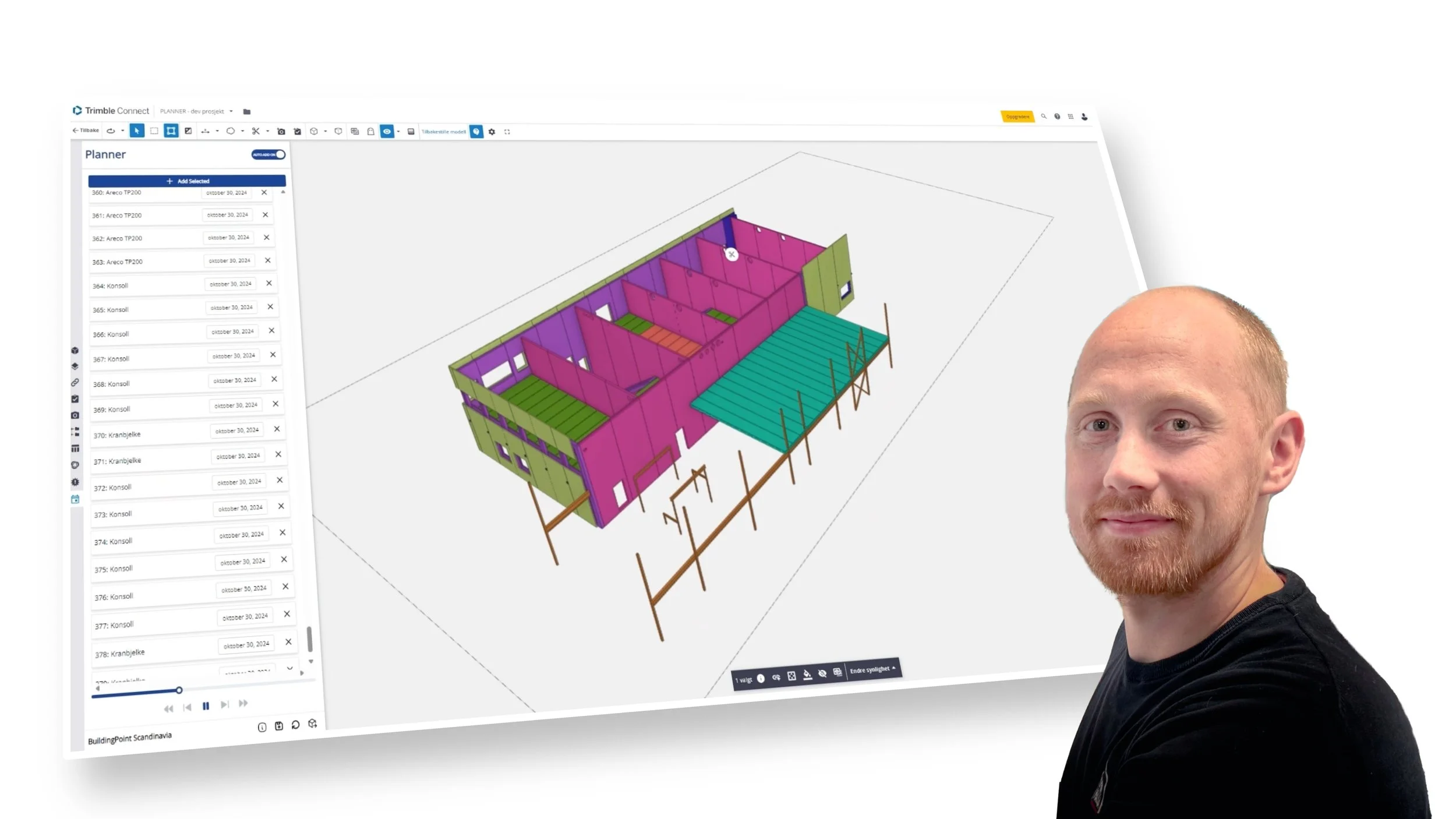 Man standing next to a computer display showing a 3D building model in Trimble Connect.