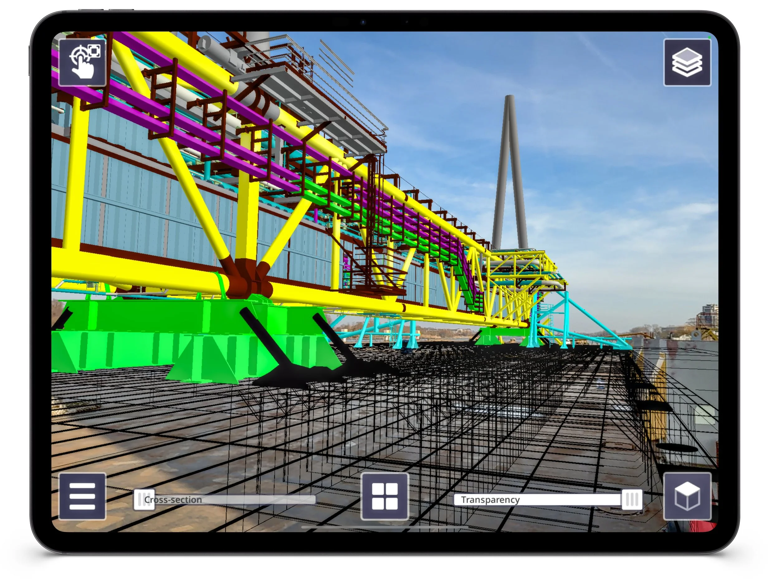 Trimble SiteVision Core - 3D digital model of a construction project with colorful structural elements on a construction site, viewed on a tablet screen.