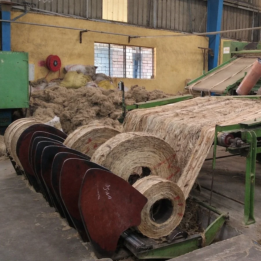 Large industrial machine processing rawhide leather in a factory.