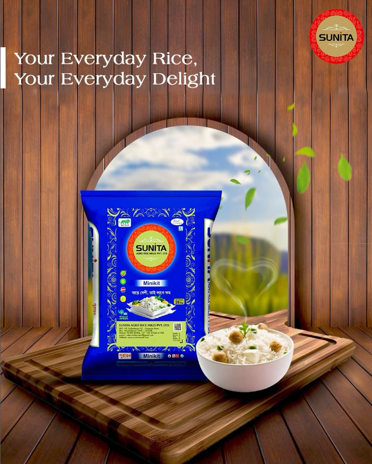 A package of Sunita Minikit rice placed on a wooden cutting board, with a bowl of cooked rice and green herbs next to it. The background features a wooden wall with a window showing a scenic landscape and the text "Your Everyday Rice, Your Everyday D