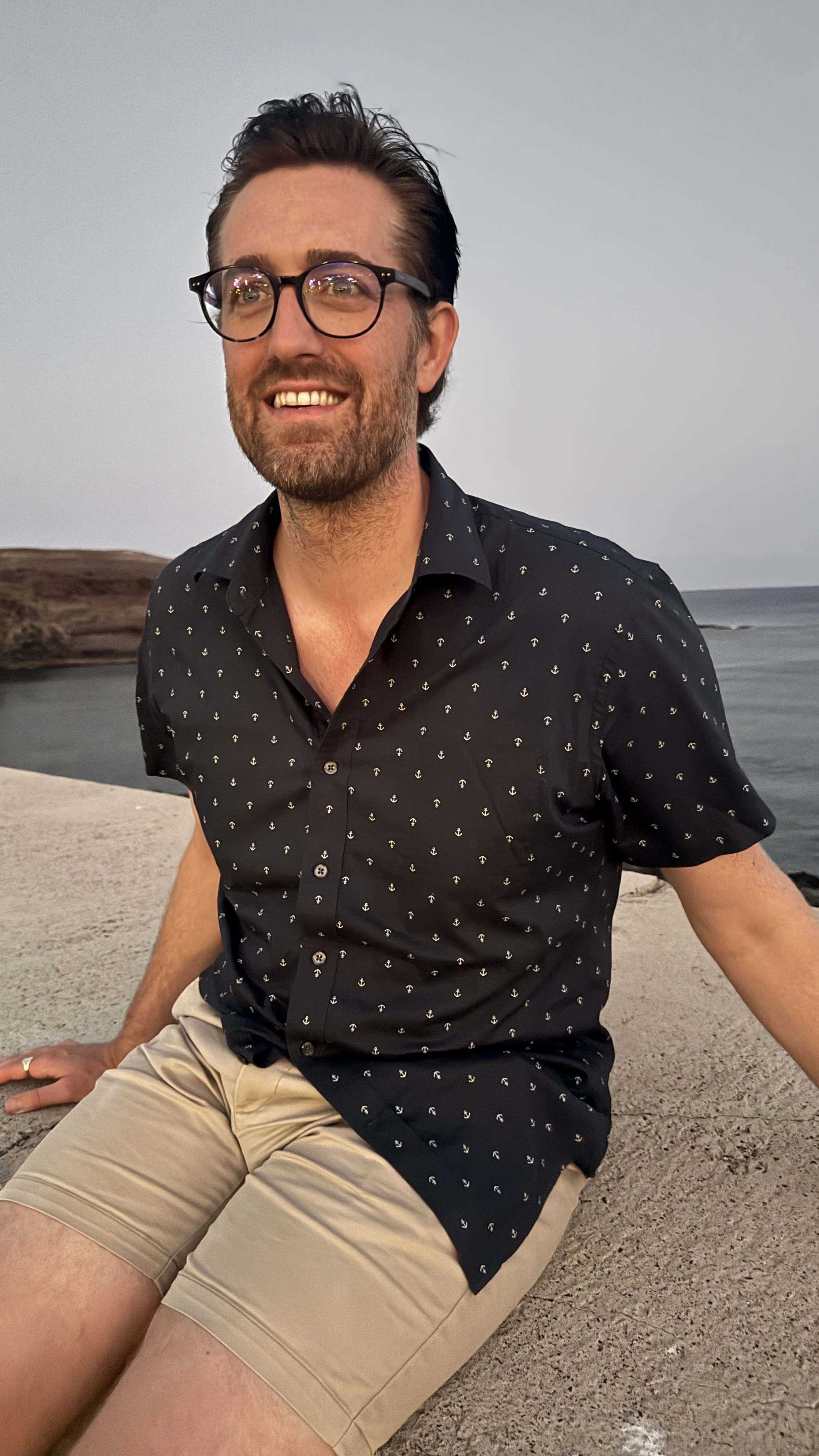 Picture of Chris Holt, smiling, on a dock