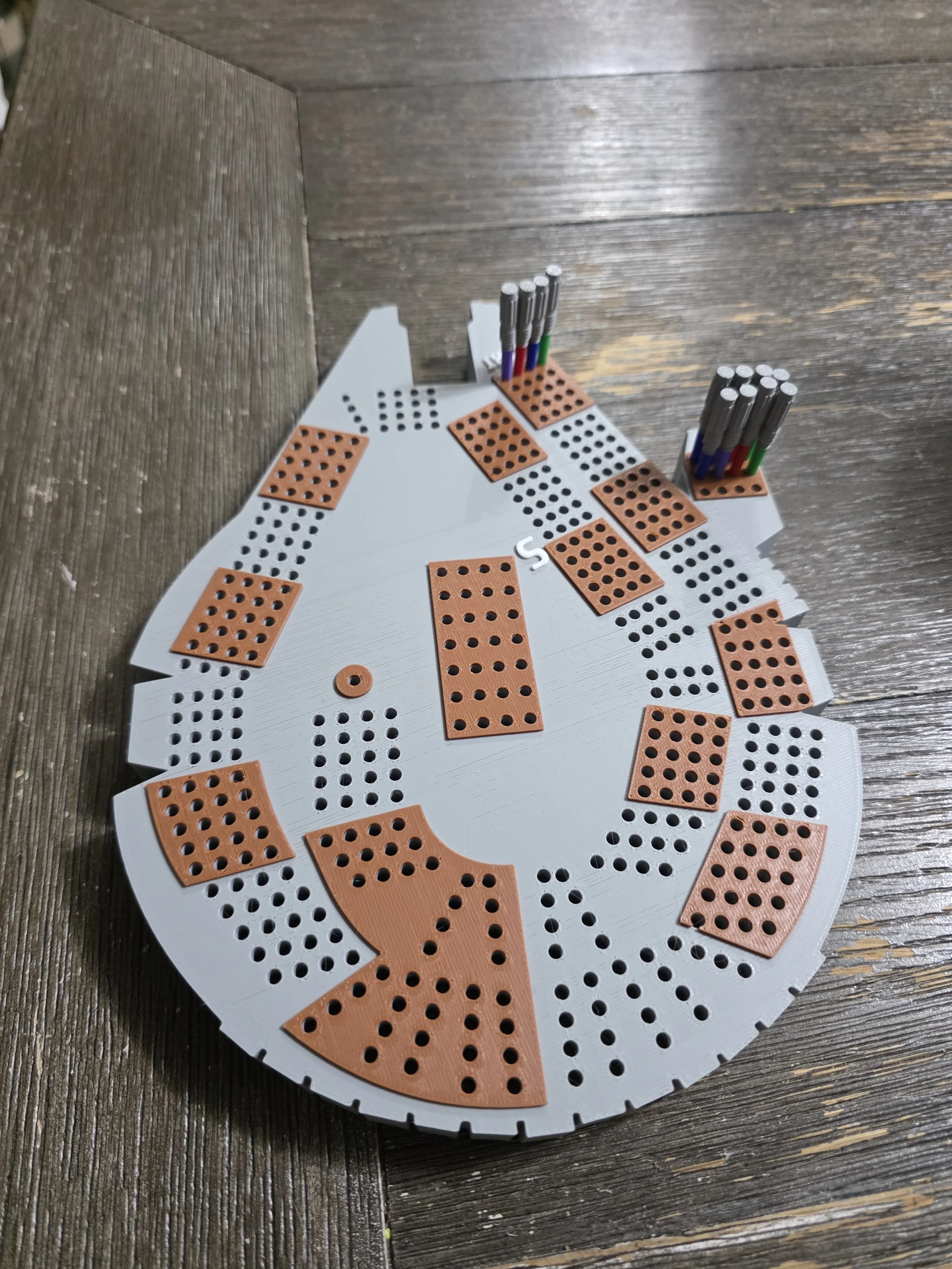 Millennium Falcon–shaped cribbage board