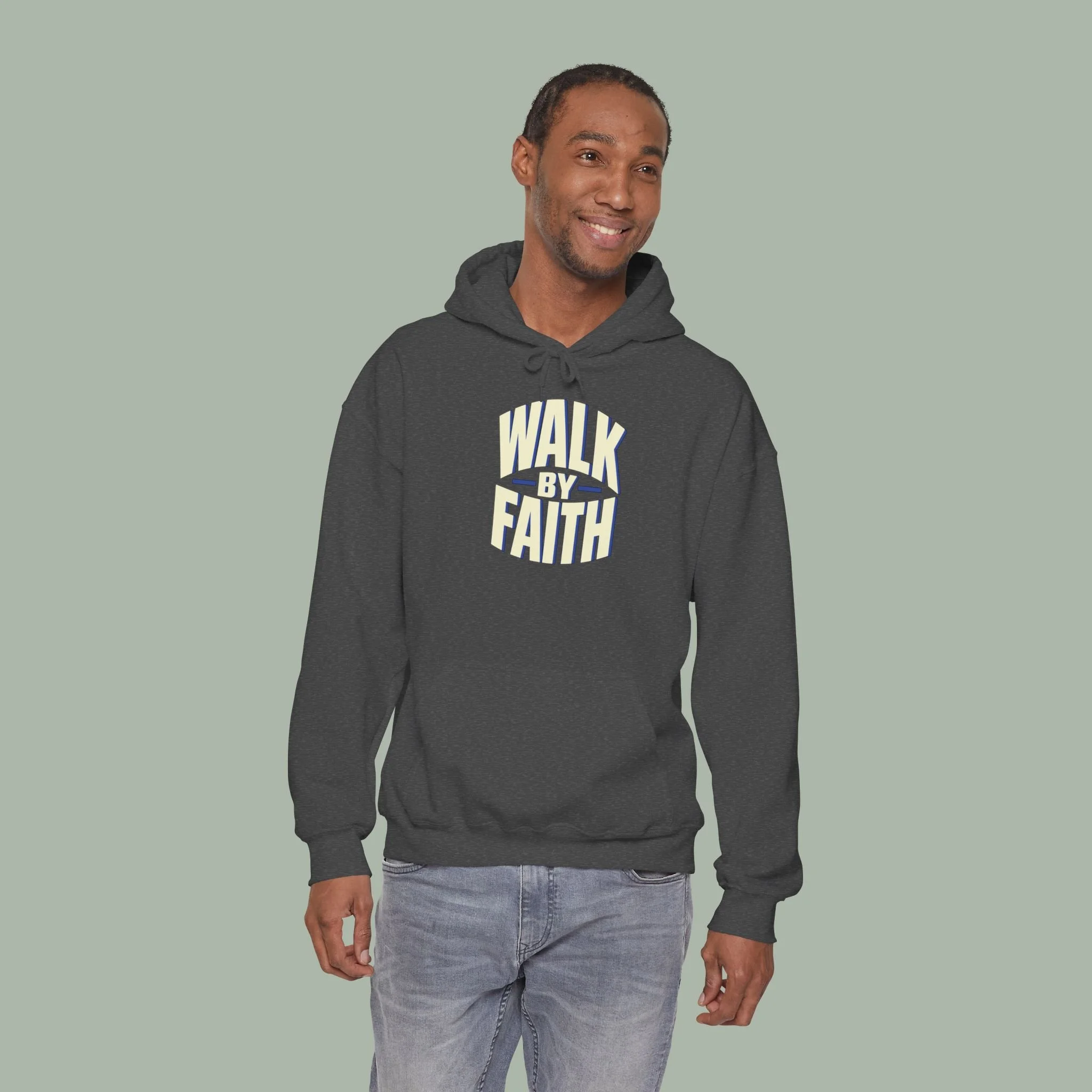 Model wearing the Dark Heather Walk by Faith hoodie, front view.