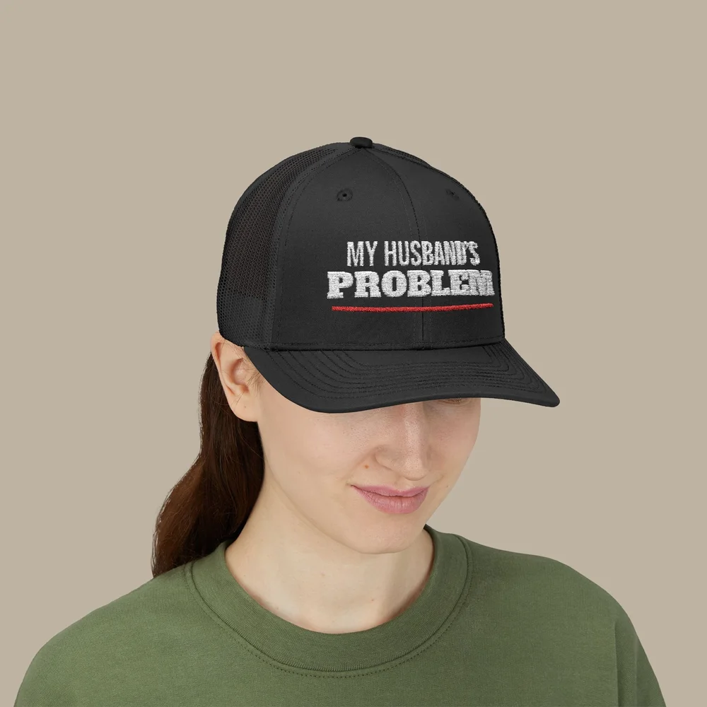 My Husband’s Problem Embroidered Trucker Hat — Black Mesh Snapback — accurate finished-product mockup