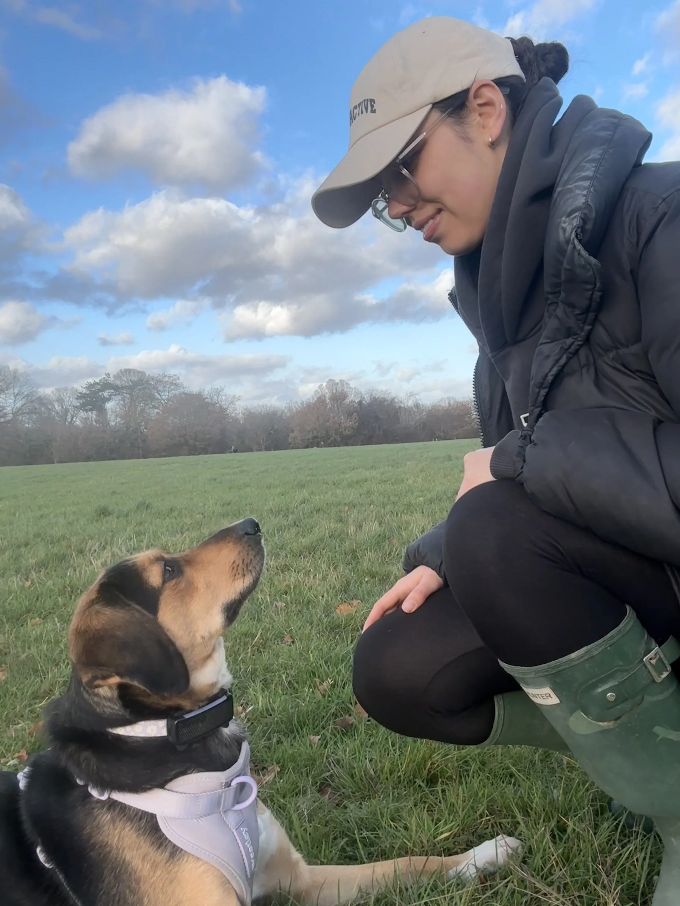 Dog trainer with rescue dog in London park