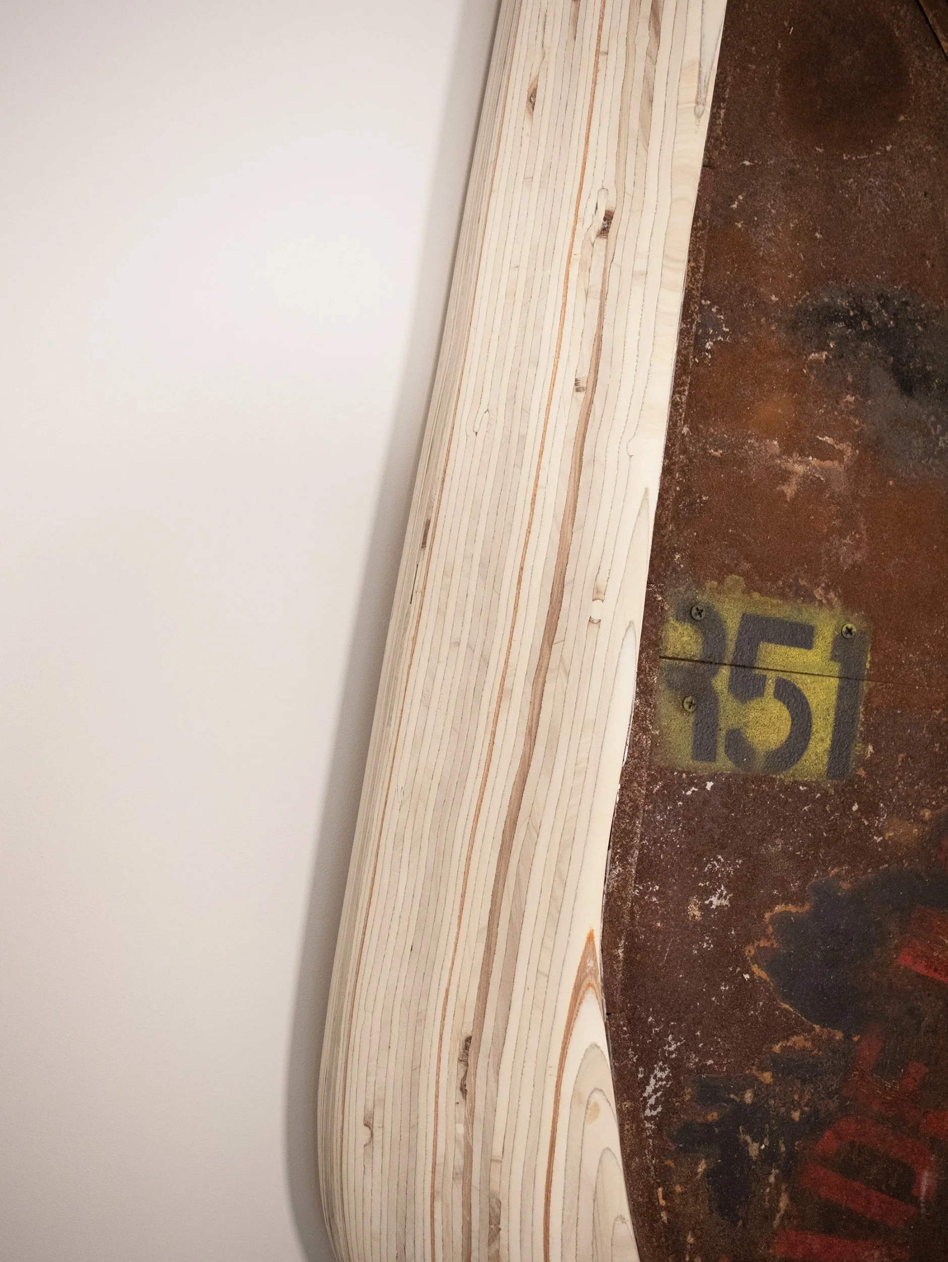A contemporary abstract wall hung sculpture inspired by industrial heritage and post industrial decay. wall decor piece made from laminated plywood and oxidized steel to rust. Titled, URBEX, post industrial decay.