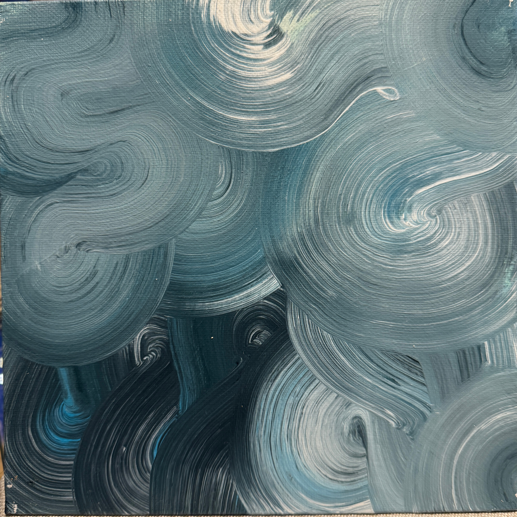 TdR 2025-C-2 | Acrylic on canvas | 25x25 cm | A dolphin blue coloured abstract painting where fluid forms drift. The layered movement suggests balance and quiet motion, shifting in slow rhythm. The works creates a sense of openness and calm.