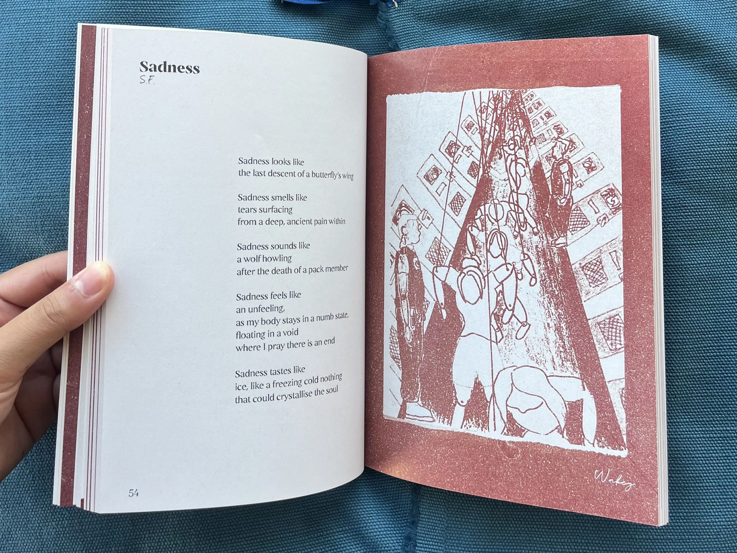 Open book showing a poem titled Sadness on the left page and an abstract illustration on the right page. The illustration depicts a group of people in an urban setting with tall buildings.