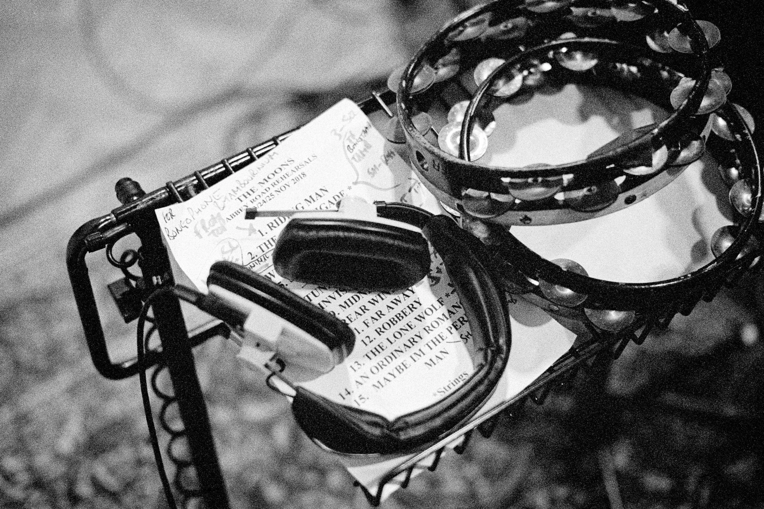 a set list with a pair of headphones on top