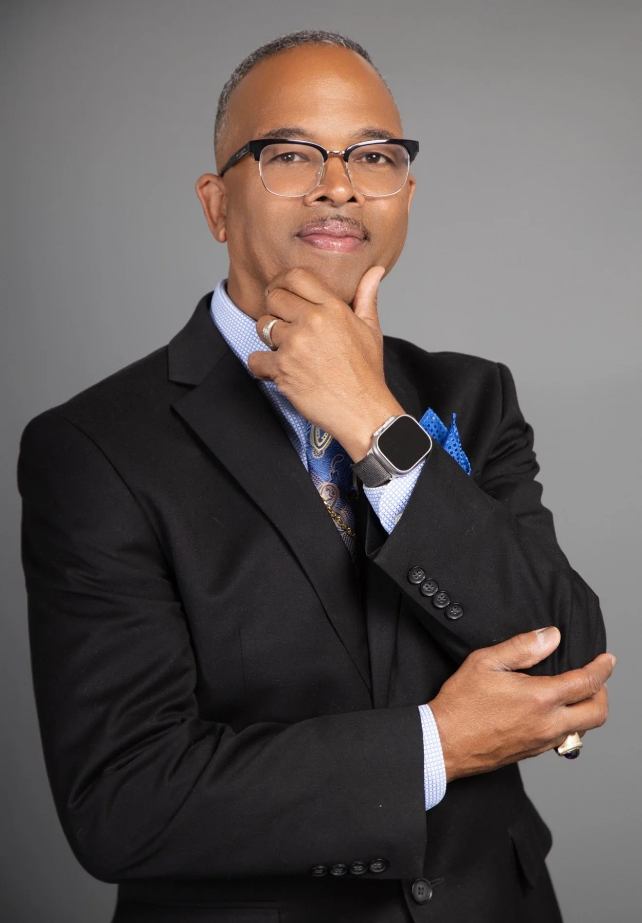 Silhouette of a person's upper body and head, with no detailed facial features, against a white background.