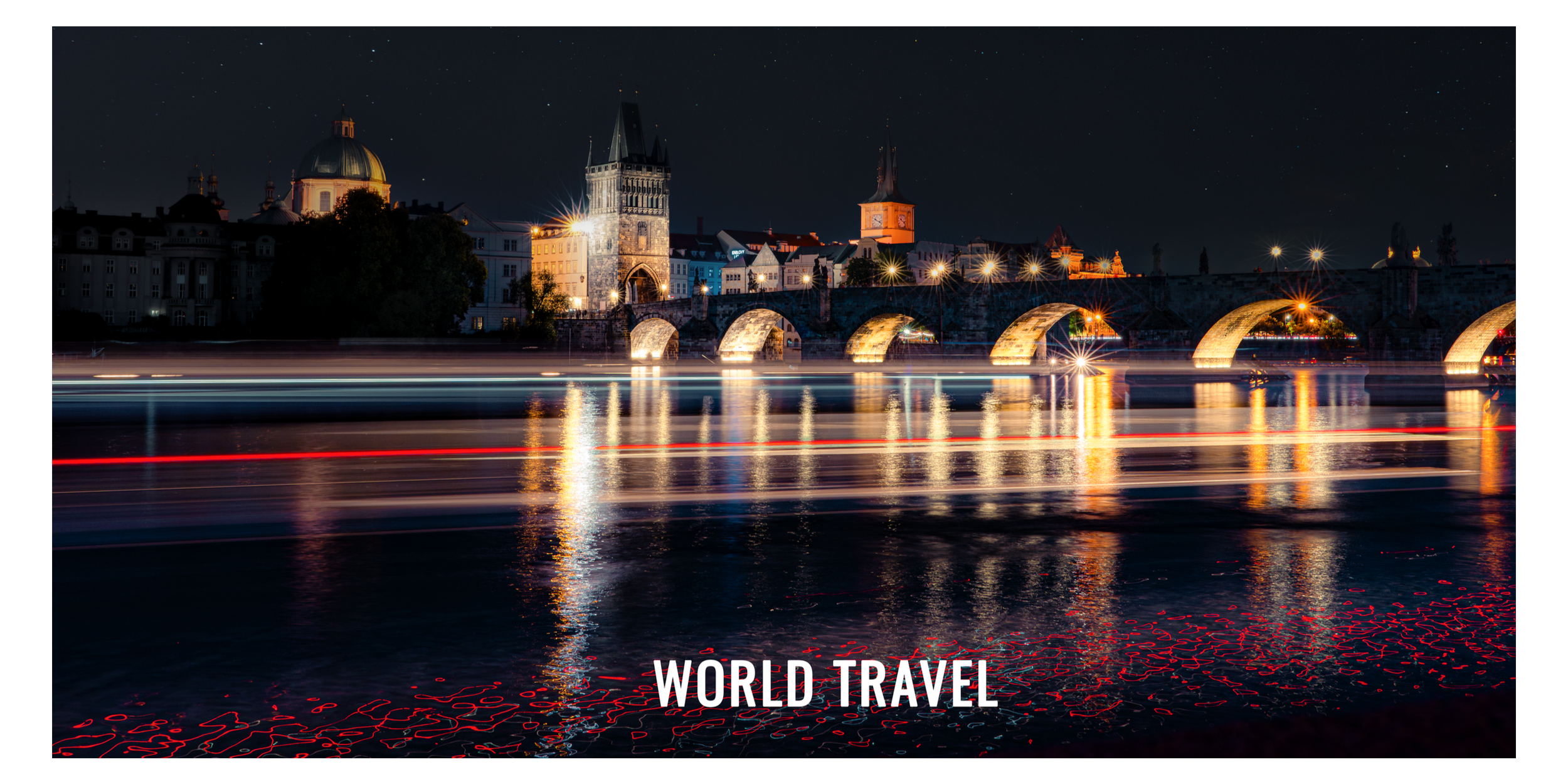 Night view of a historic European city, with a stone bridge over a river, illuminated buildings, and starry sky.