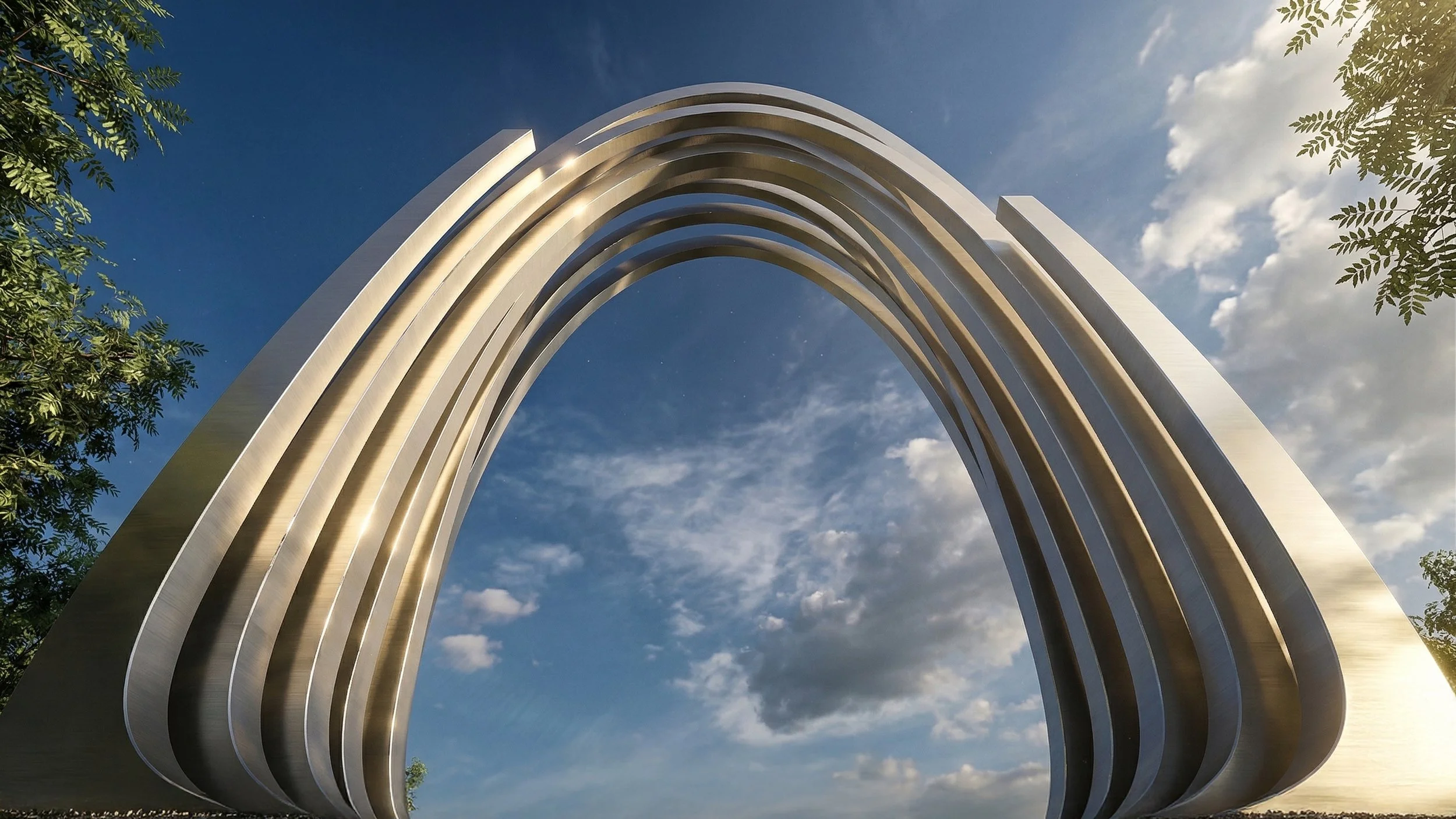 A large, modern metallic arch structure with multiple curved layers, viewed from below against a partly cloudy sky with some green tree branches visible on the sides.