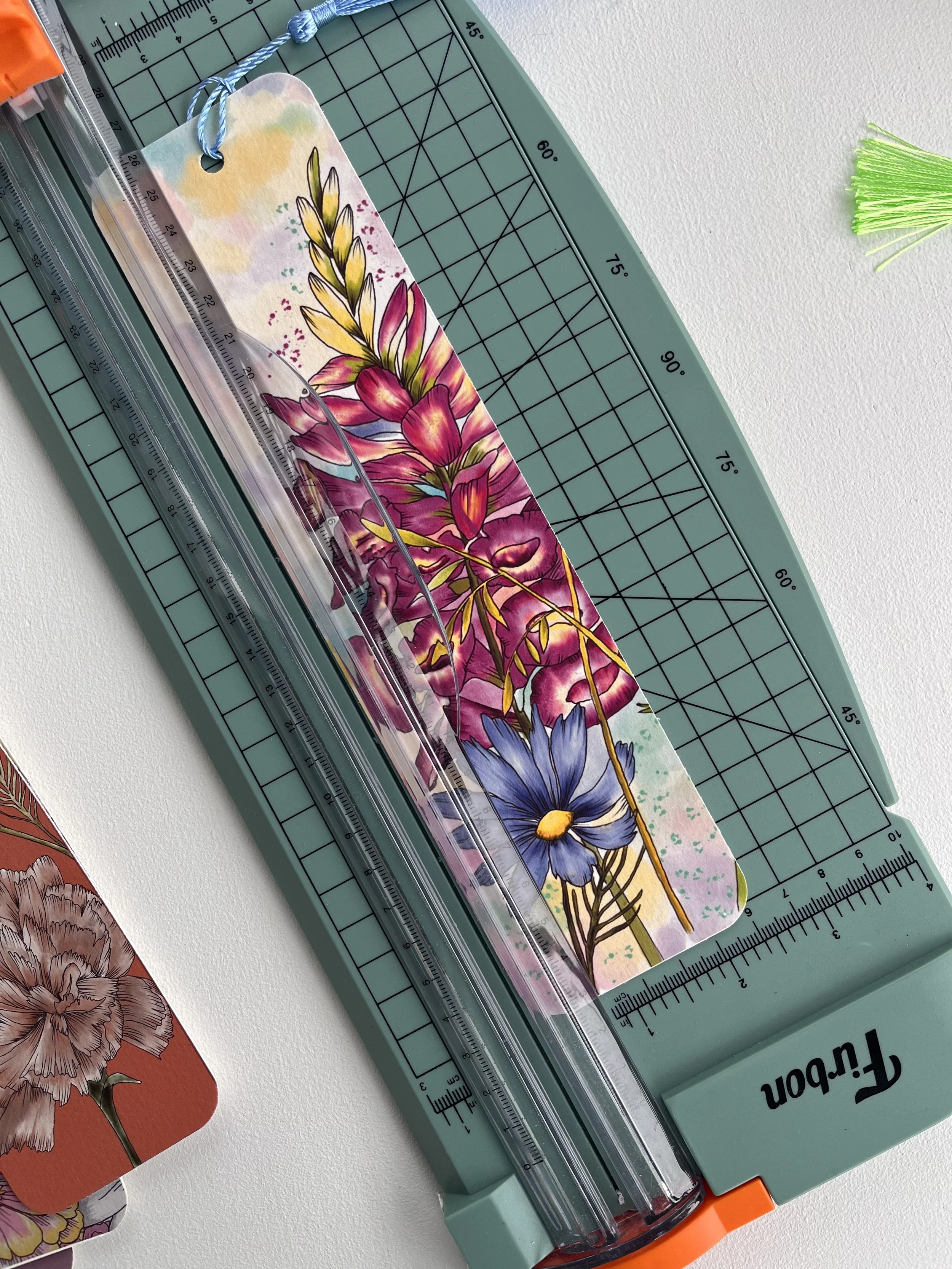 Wildflower bookmark with pink foxglove flowers photographed on a slide cutter