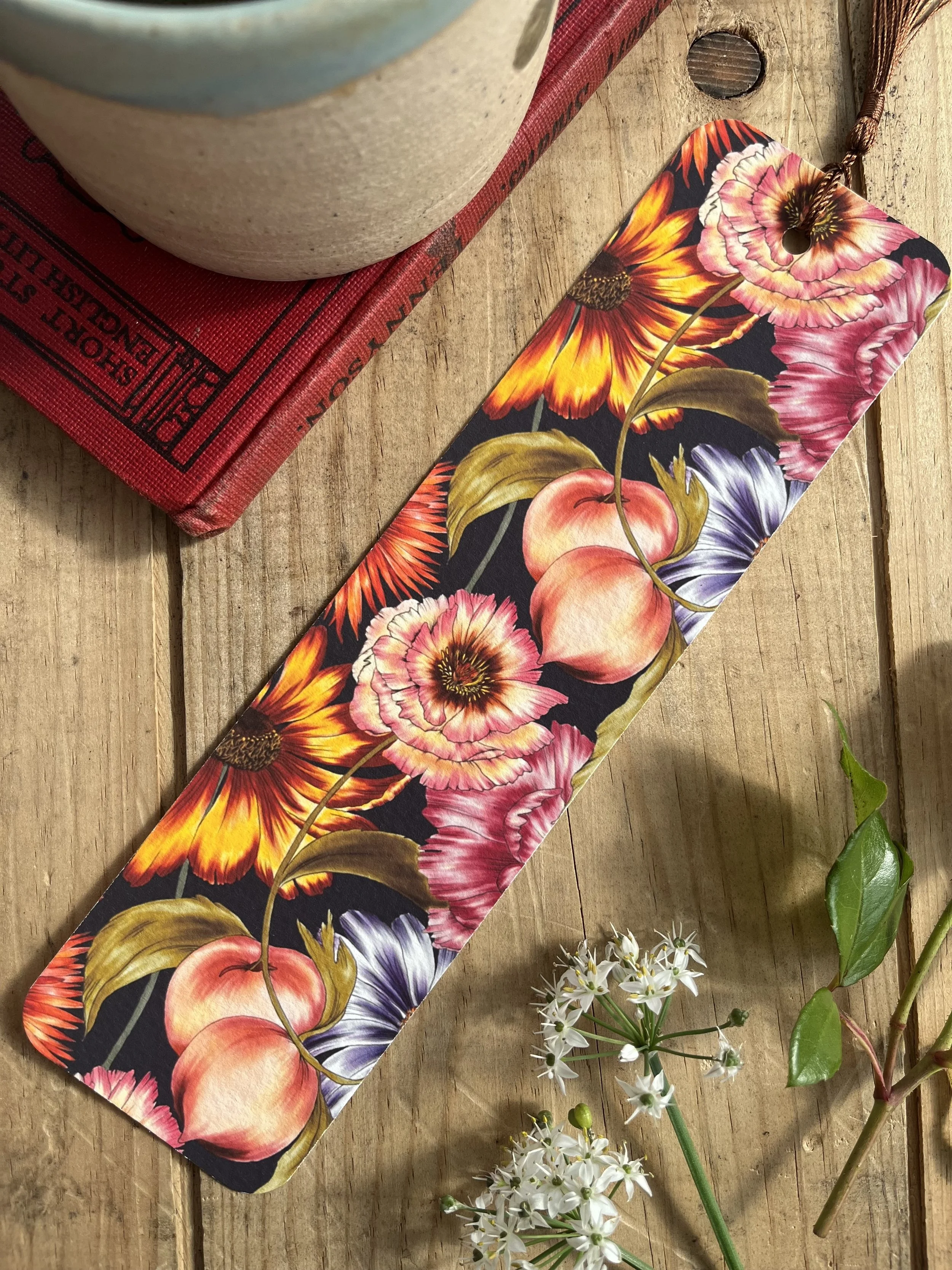 Navy blue bookmark with peaches.