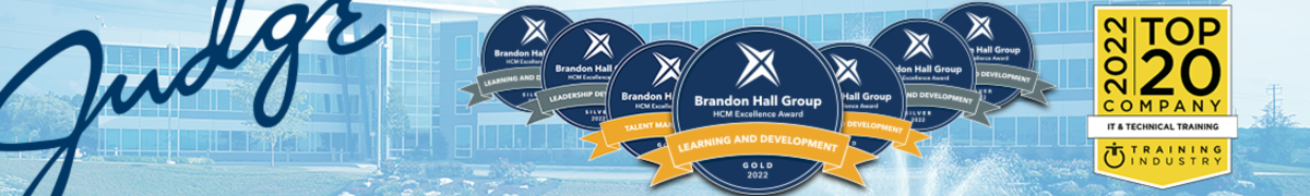 A banner displaying multiple awards from the Brandon Hall Group for excellence in talent management, learning, and development, awarded in 2022. The awards are labeled 'Gold' and 'Top 20 Company in IT & Technical Training Industry'.