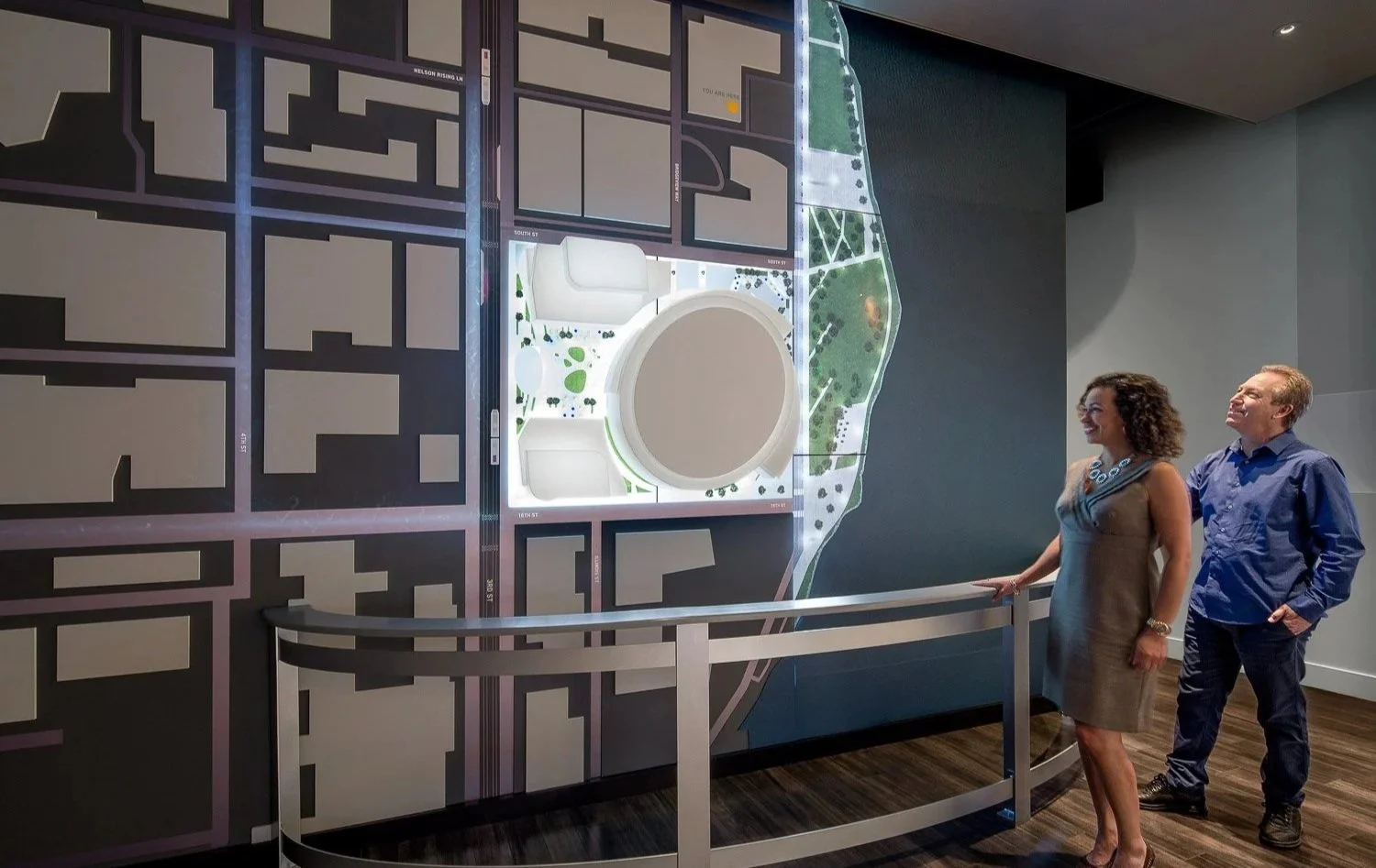 The District: Upon exiting the theater, visitors are introduced to a large-scale mixed-media depiction of the neighborhood. A mixture of dynamic video and projected content bring the wall to life and showcase amenities in the neighborhood