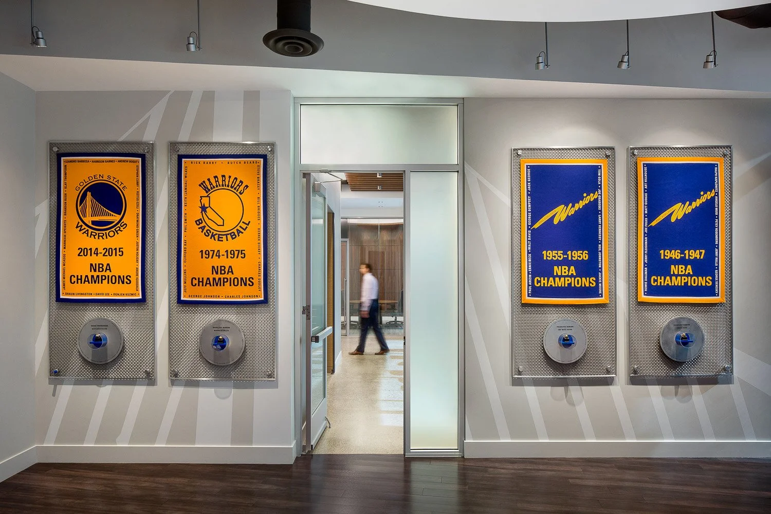 Championship wall: Before continuing on to view full-size suite mock-ups, visitors encounter a display of championship banners and rings