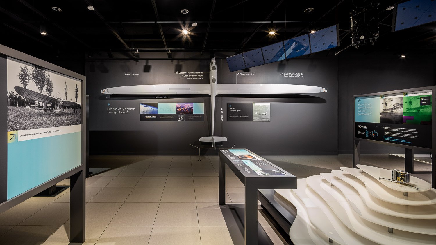 Curated exhibits and a modular display system are built over a raised flooring system to enable easy changeouts.
