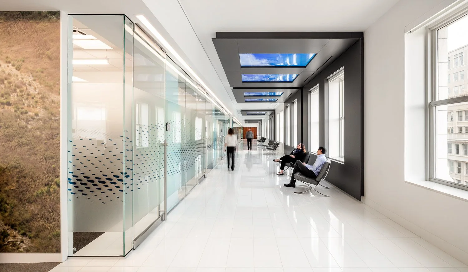 Ten windows line the ceiling depicting motion graphics with daytime Contrail views of flight patterns and Galaxy mode at night with orbiting satellites.