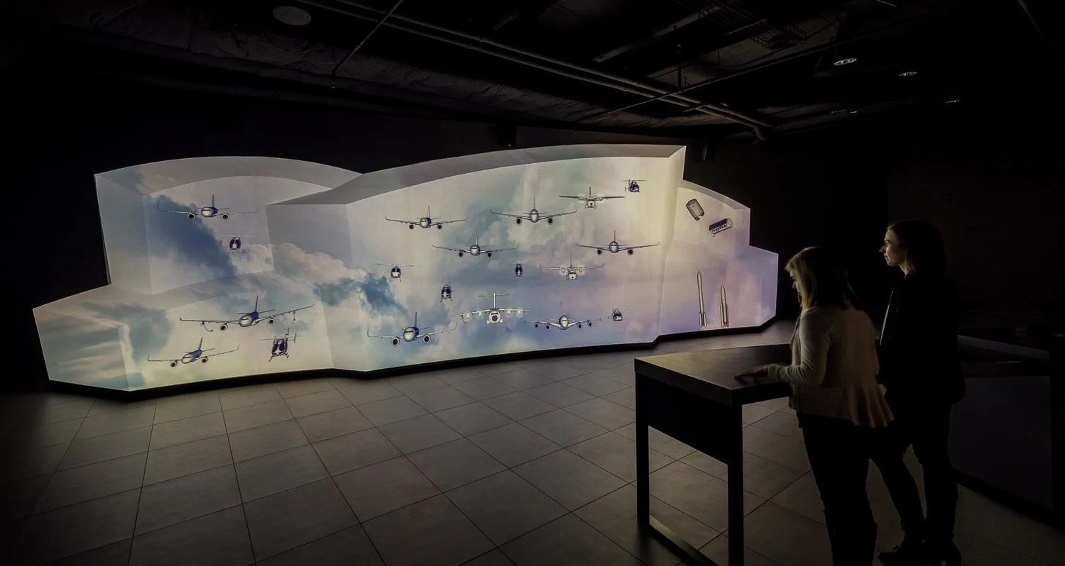 To bring Airbus products to life, visitors encounter a 40-foot-long Fleet Wall, with projected imagery and interactive 3D models that animate across the sculpted and shaped surface. Visitors become much more immersed in the breadth of the product off