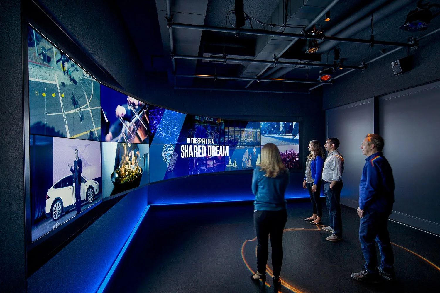 Immersion: A dramatic black-box theater-like setting with custom anthem video to introduce and excite visitors