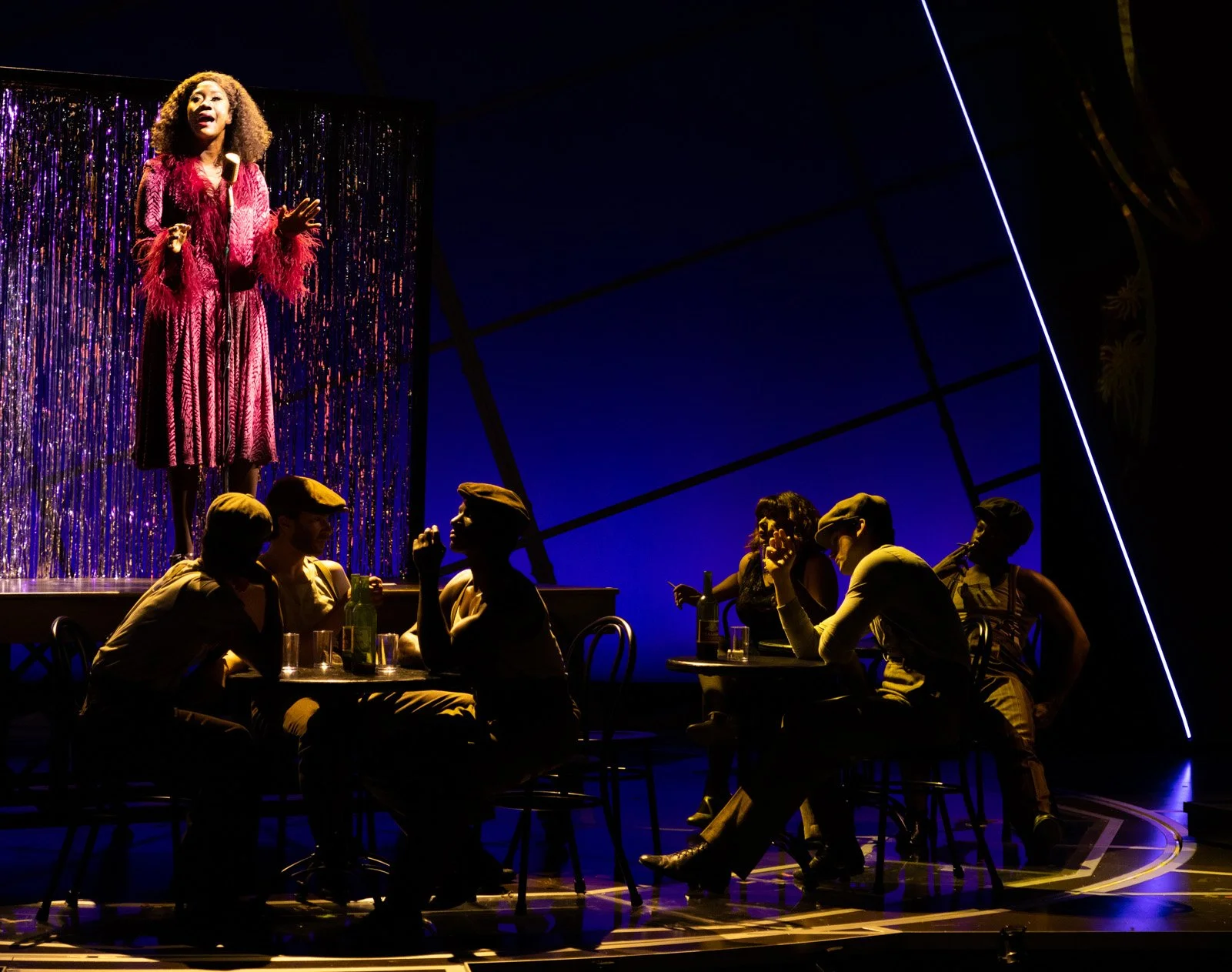 Amber Iman (top) as “Rafaela” with cast members in LEMPICK