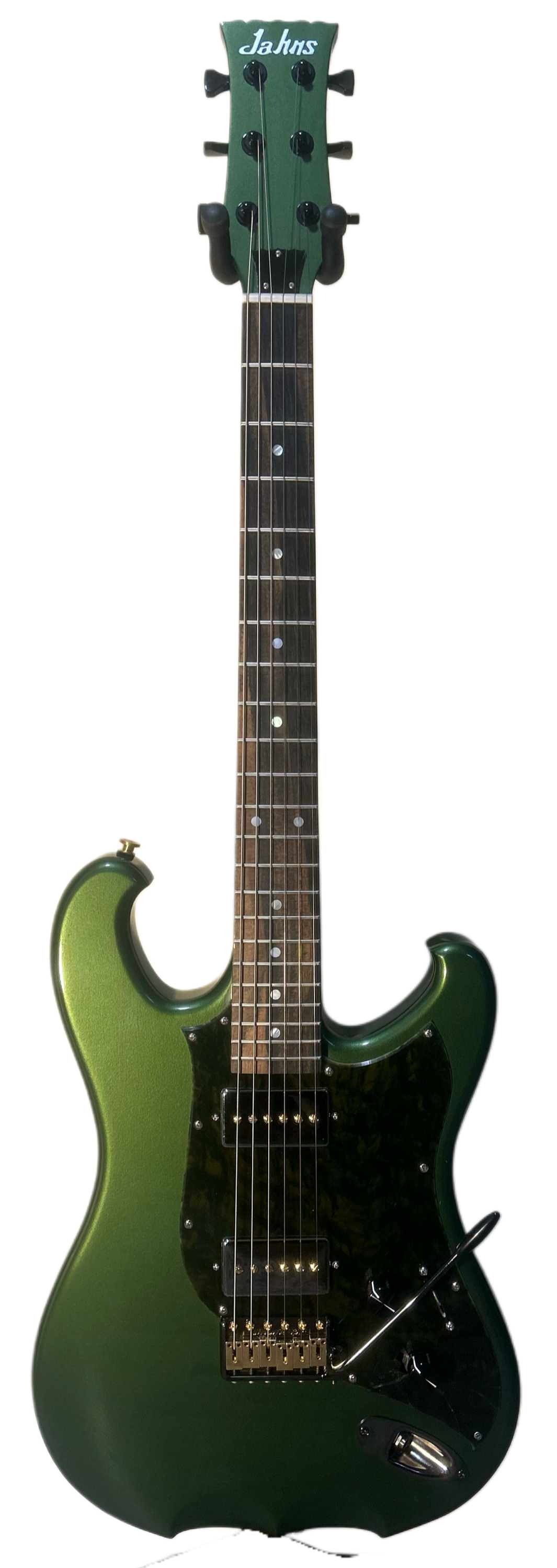 • Green nitrocellulose lacquer finish
• Korina body
• Korina neck
• Pale Moon ebony fretboard with genuine mother-of-pearl dot inlays
• 10” radius
• 25.5” scale length
• Dual humbucker-sized P90 pickups
• Black & gold MannMade bridge
• Locking Hipsho