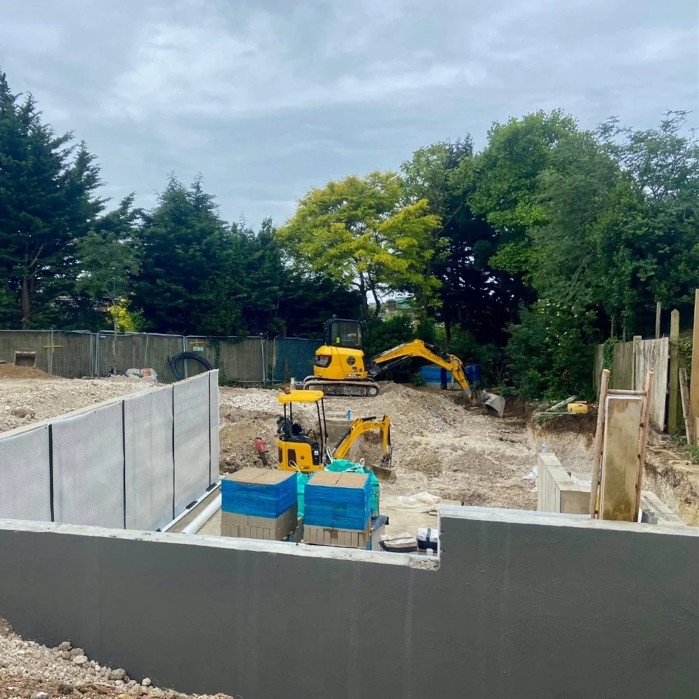 Before - looking south, across the lower ground apartment towards the lowest point of the triangular plot
