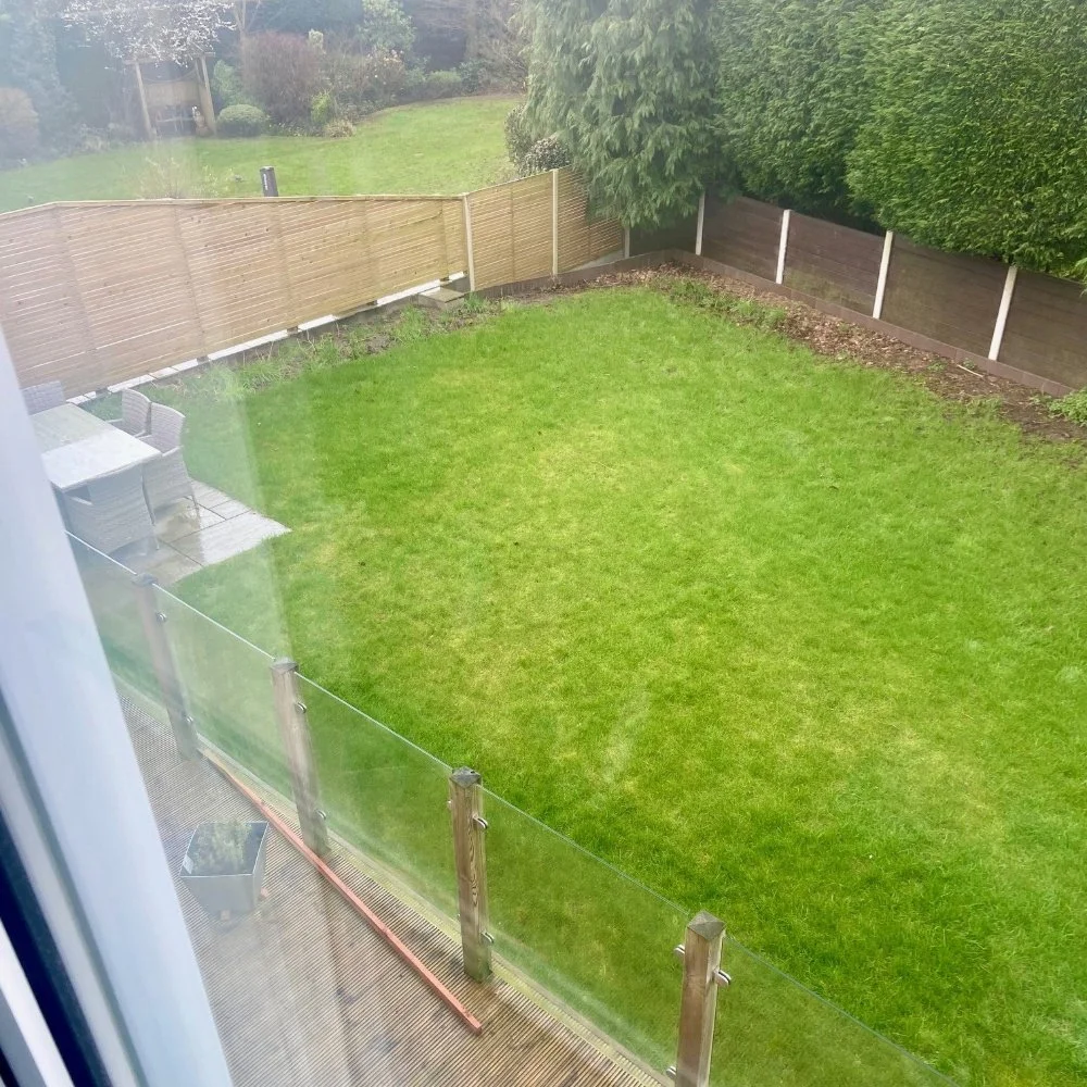 Before - looking from the house to the south-east, a view dominated by lawn and the leylandii hedge